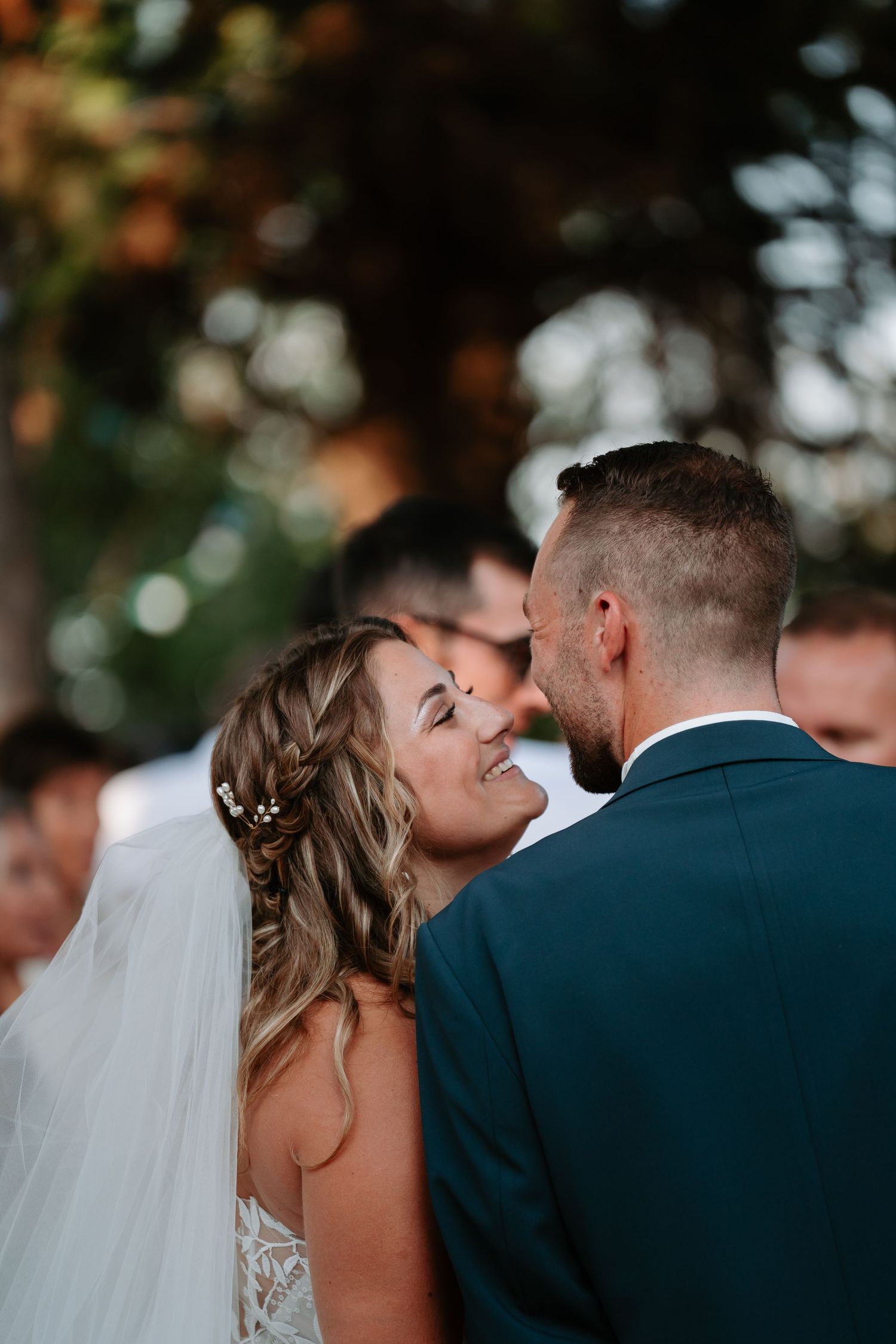 A romantic sequence of wedding photos showing a couple sharing tender moments during their outdoor ceremony.