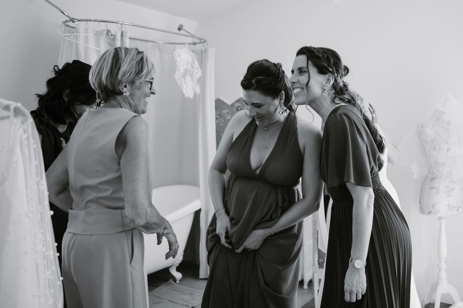 A series of black and white photos showing people getting ready in formal attire before a wedding ceremony.