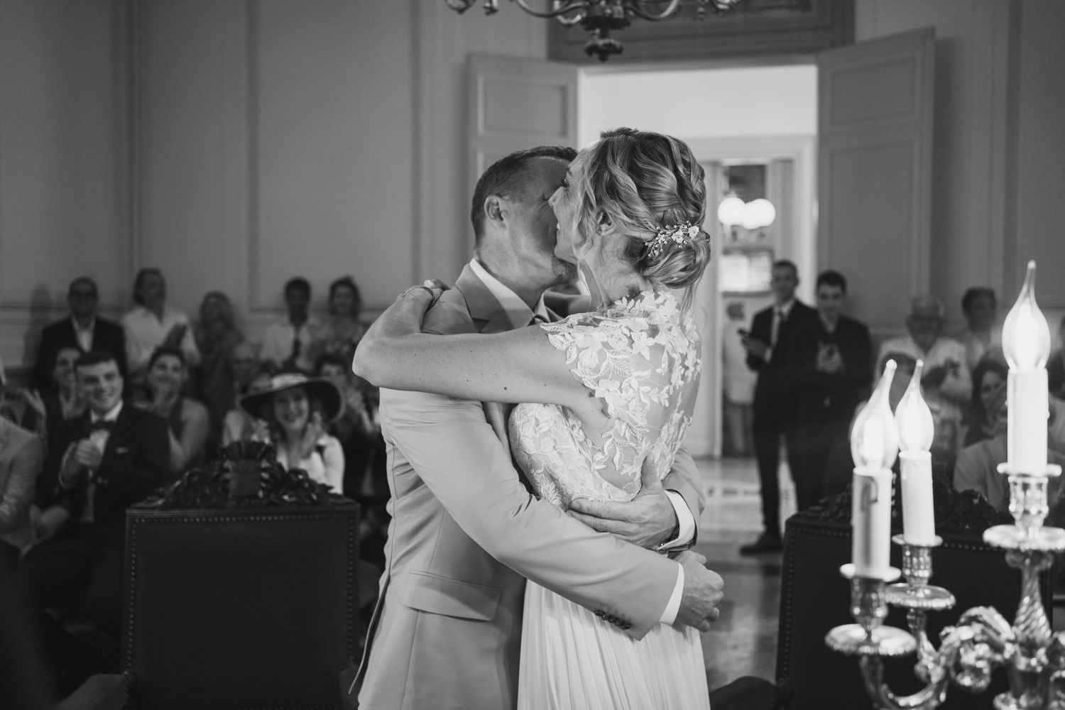 Black and white wedding reception photos showing couples dancing and embracing on the dance floor.