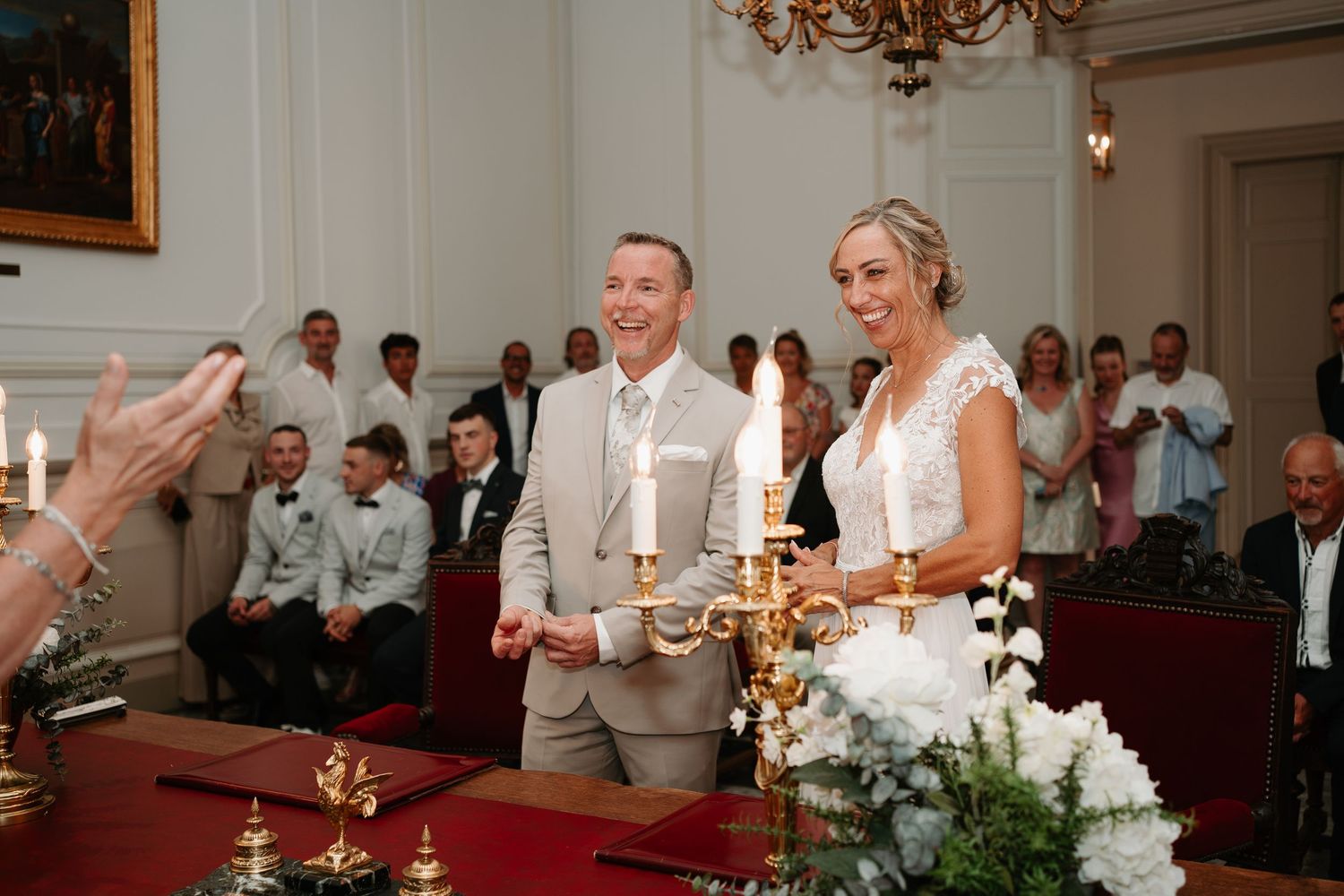 A series of wedding reception photos showing candlelit tables, dancing, and celebratory moments in an elegant ballroom.