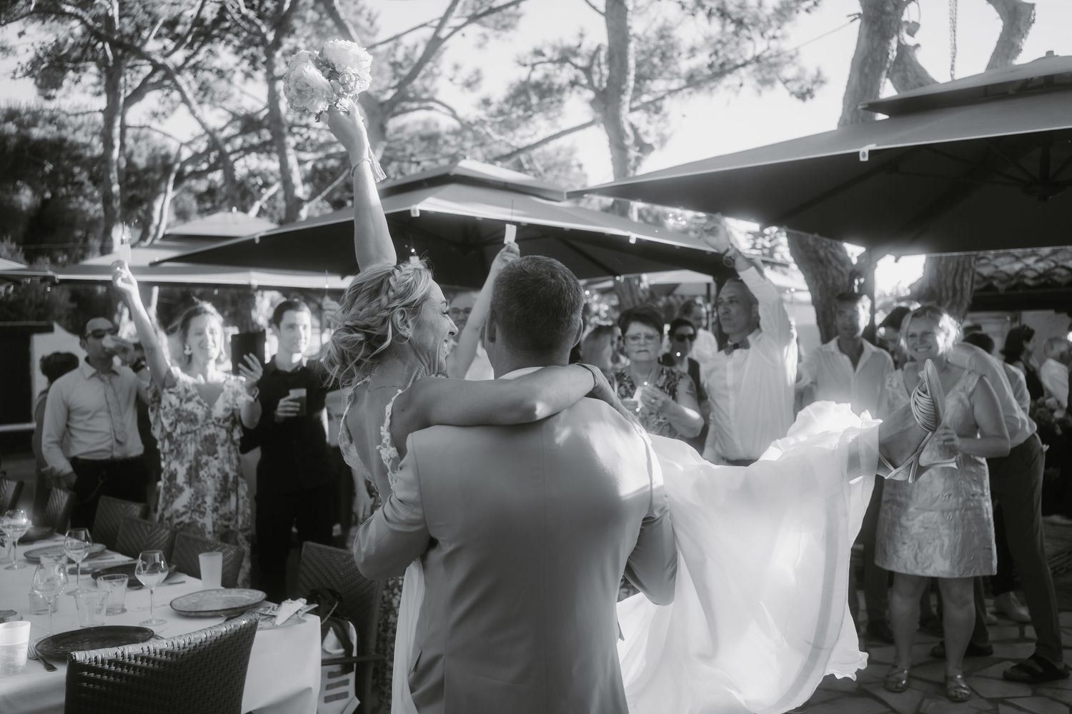 Black and white photo sequence showing couples dancing together at an outdoor celebration or reception event.