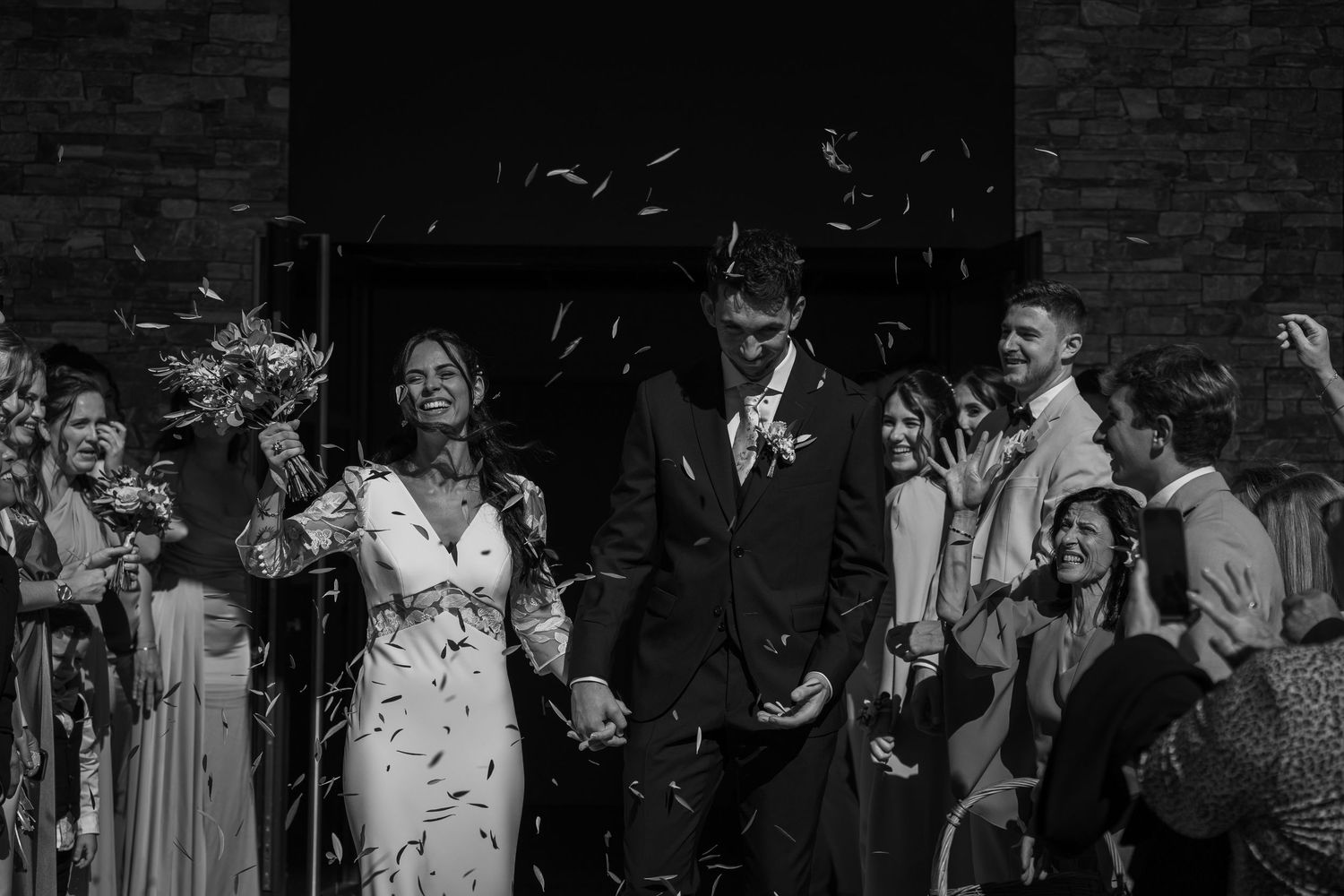 A black and white photo strip showing multiple candid moments of people at what appears to be a social gathering.