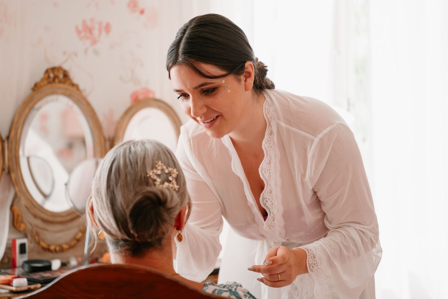 Healthcare workers in white uniforms provide care and assistance to elderly patients in a medical facility.