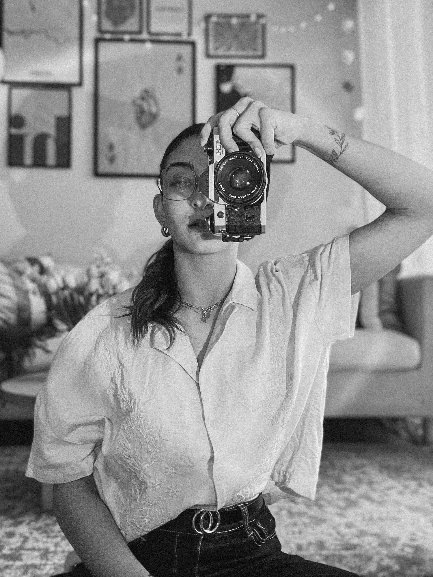 Vintage camera photography session in black and white with artistic composition.
