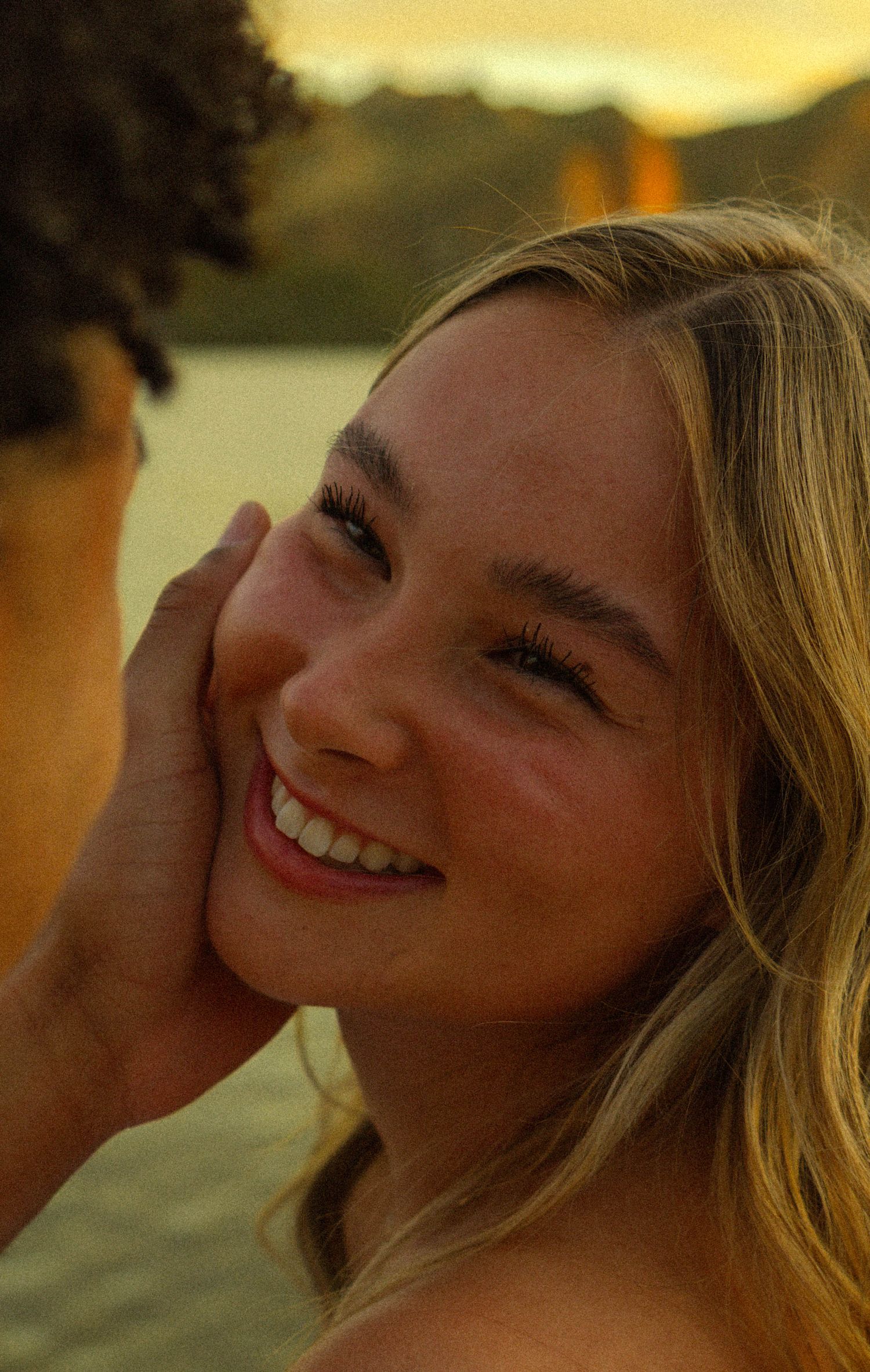 A series of close-up shots showing expressions during golden hour lighting.
