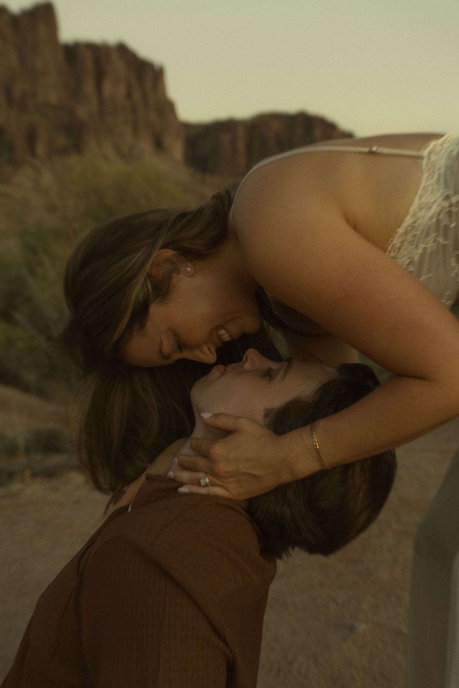 Intimate close-up of couple sharing a romantic moment in the Arizona desert.