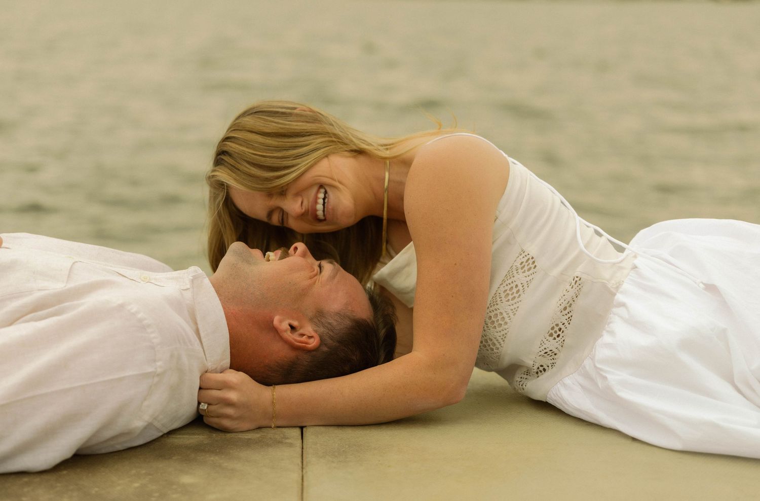 A series of photos showing a person in white clothing lying down on a light colored surface.