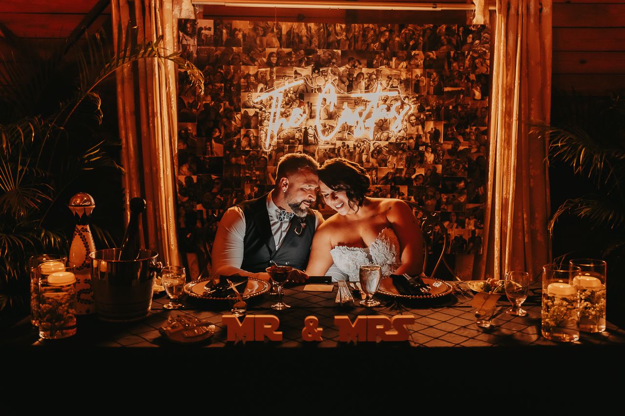 Warm candlelit venue with vintage decor and romantic lighting for a wedding reception.