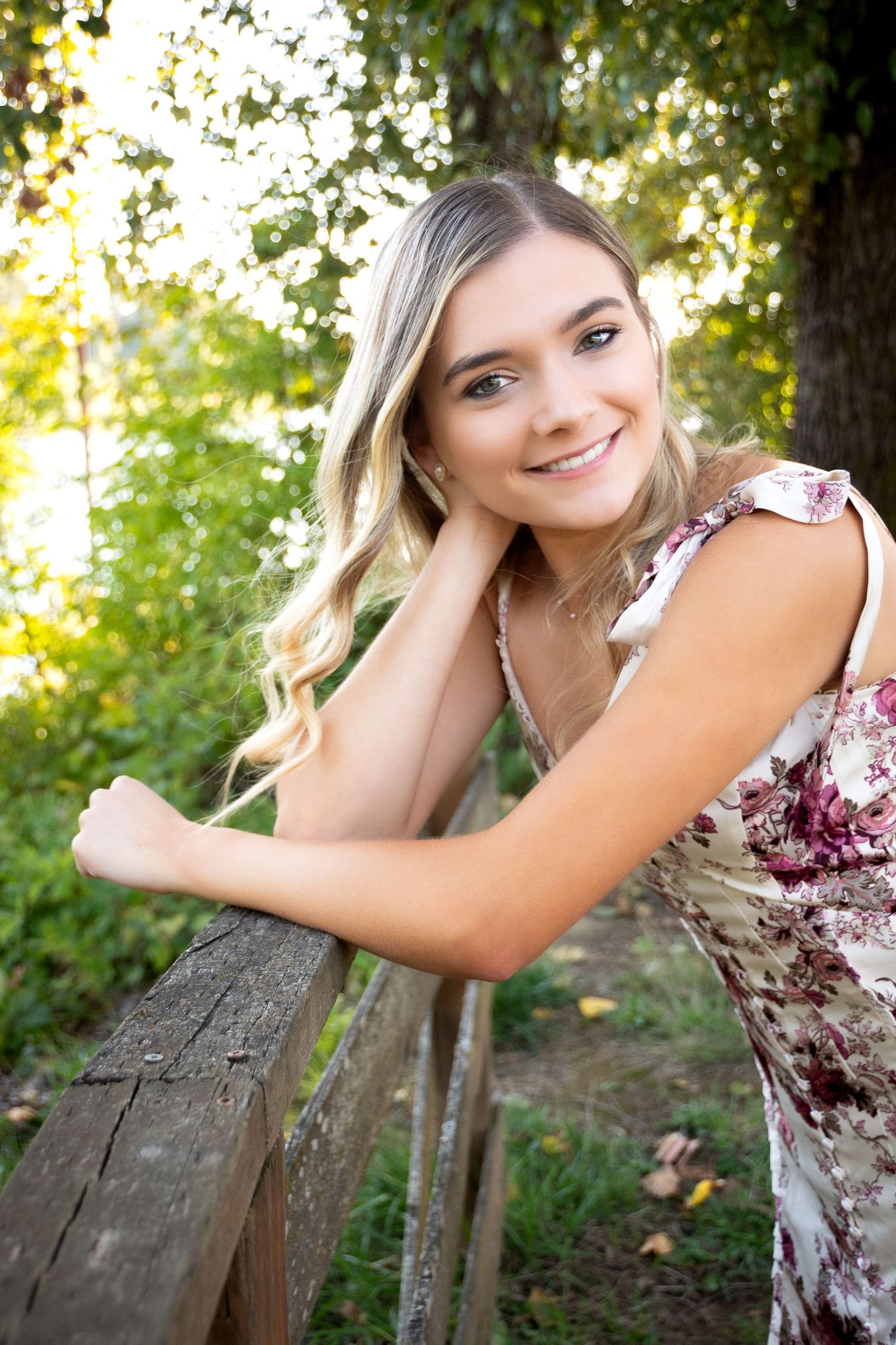A series of outdoor portrait photos showing someone posing against a tree in natural lighting.