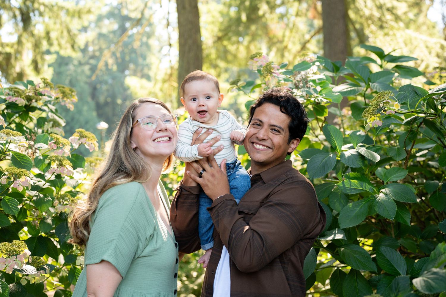 Family portrait series with natural interactions in sunlit garden. Family session. Portrait photography. Oregon.