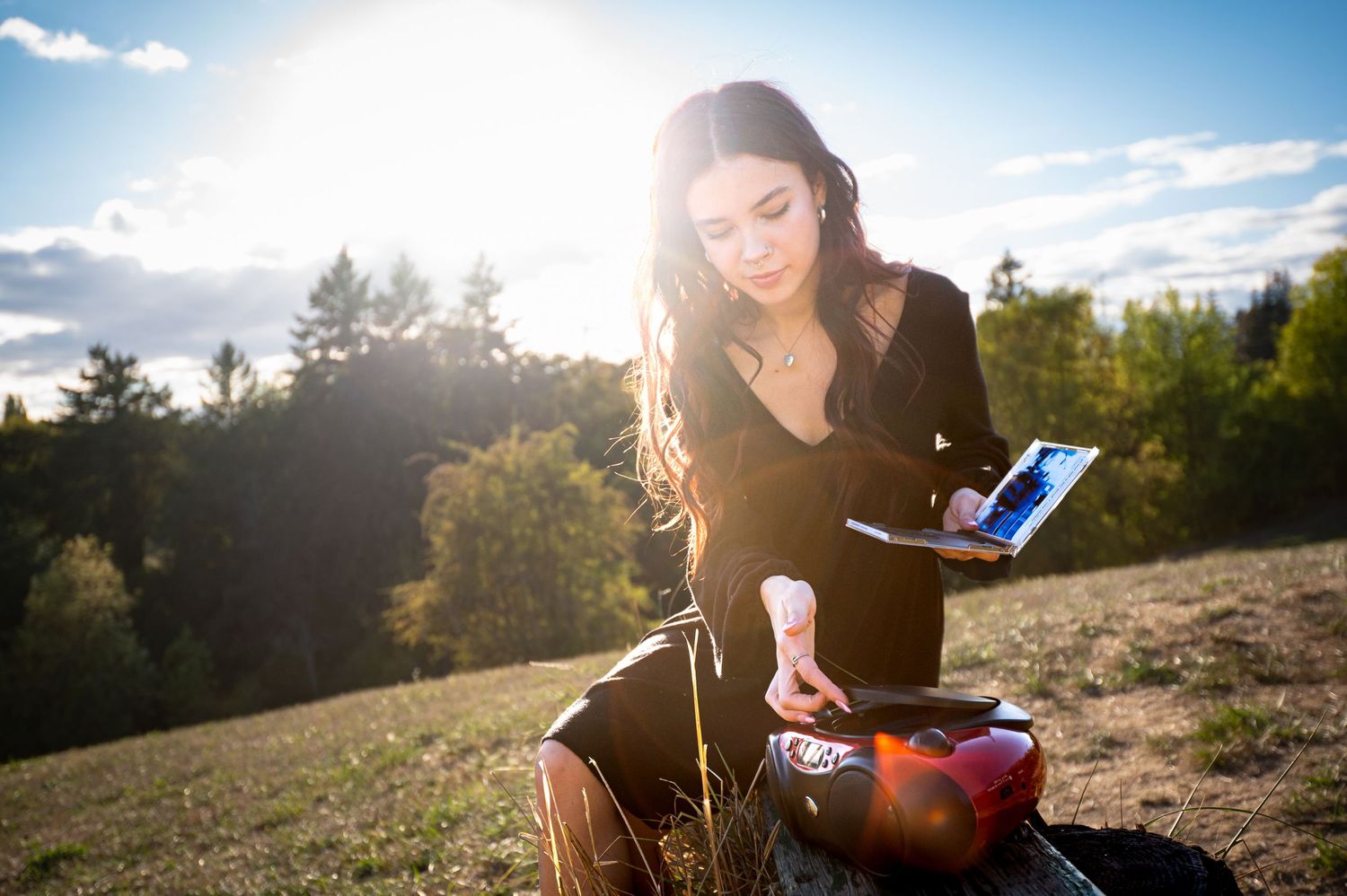 Sunlit outdoor photography session with dramatic lens flare effects.