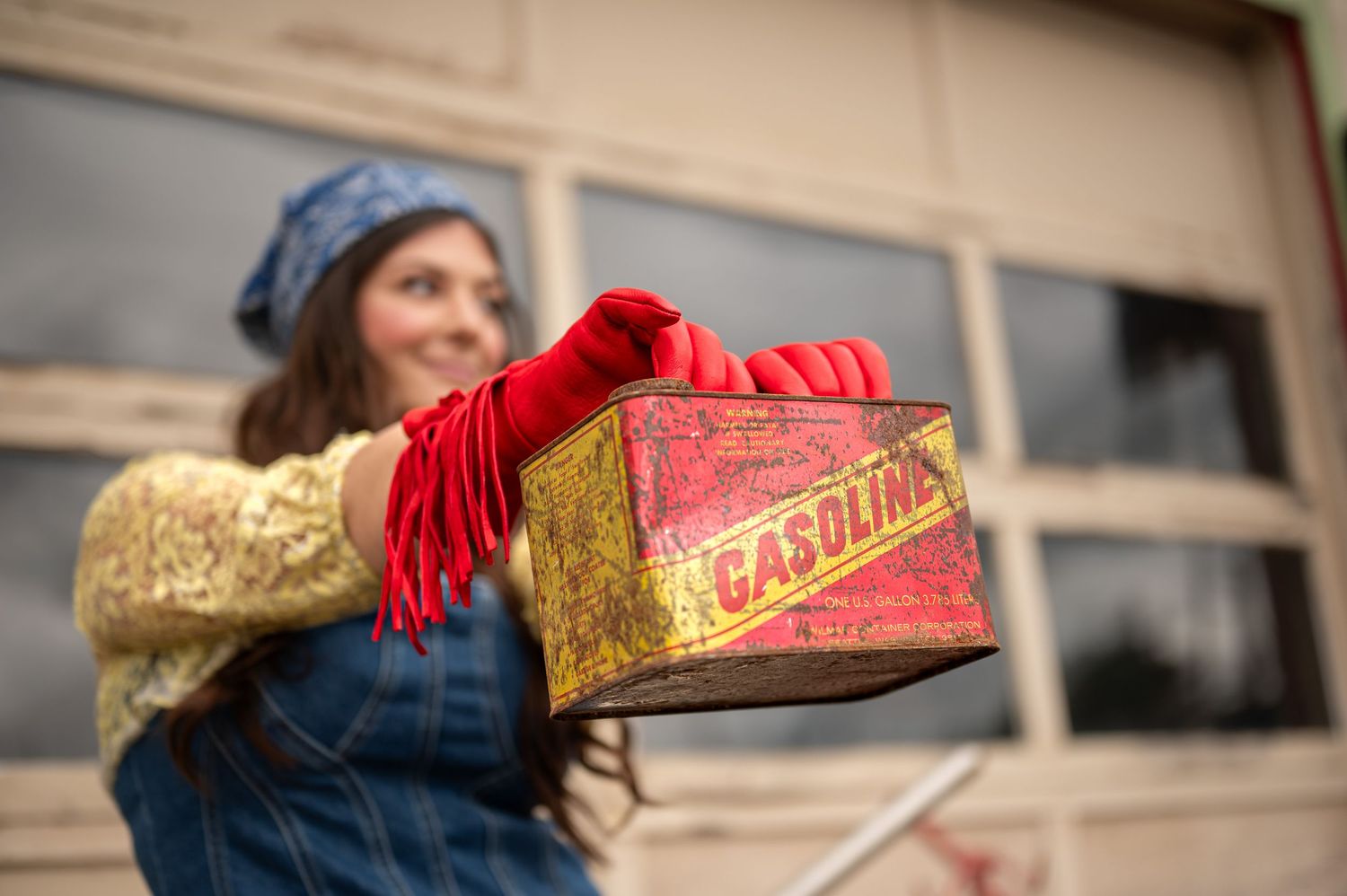 Vintage-style scene with red gloves and retro props against industrial backdrop. Portland, Oregon. Creative portfolio.