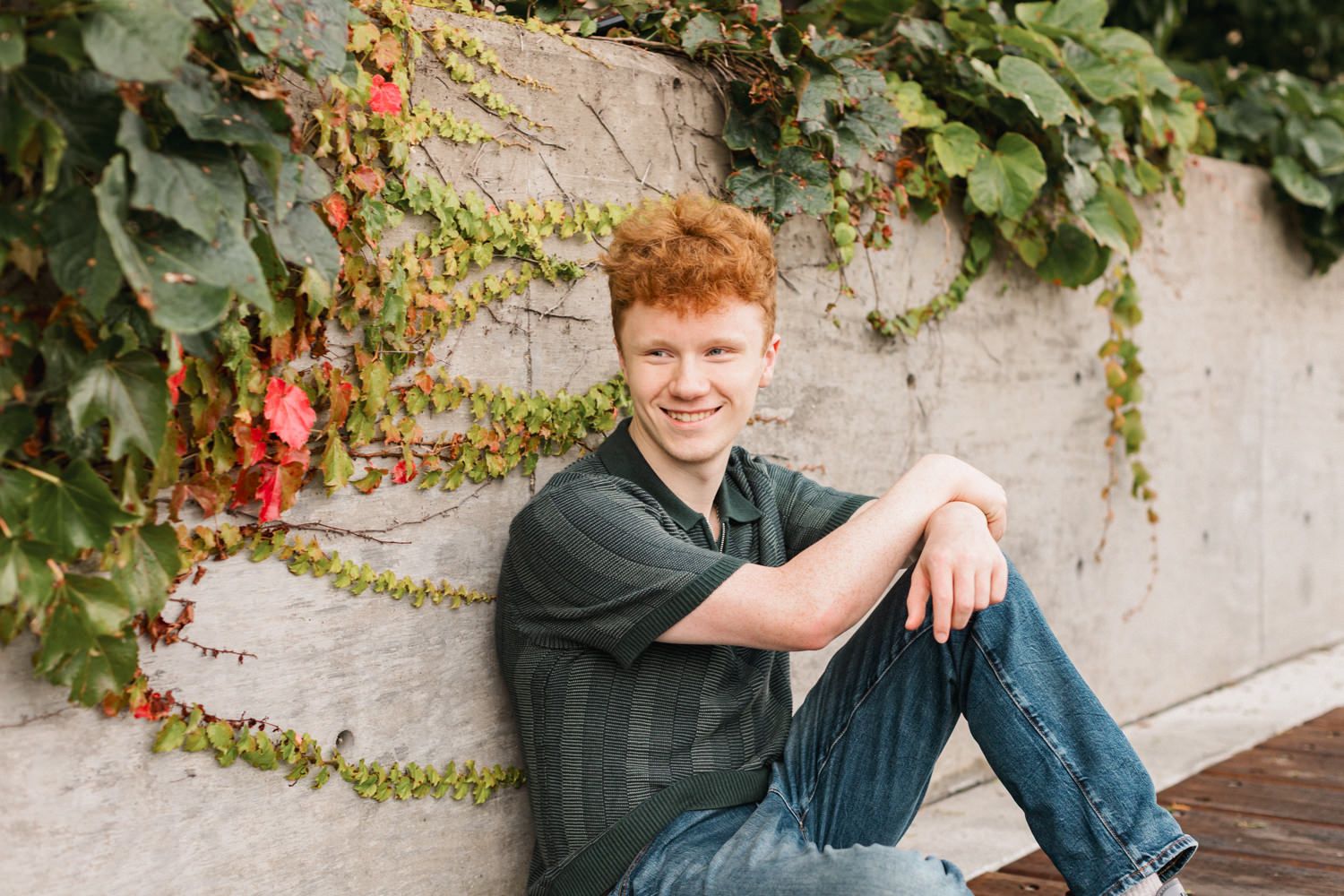 Casual outdoor portraits with natural lighting and vine-covered wall backdrop.