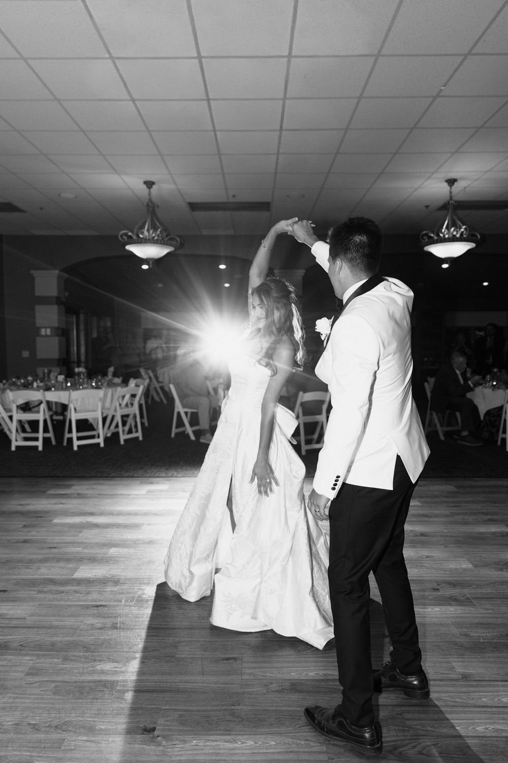 Black and white photos of wedding dance floor moments in a reception hall.