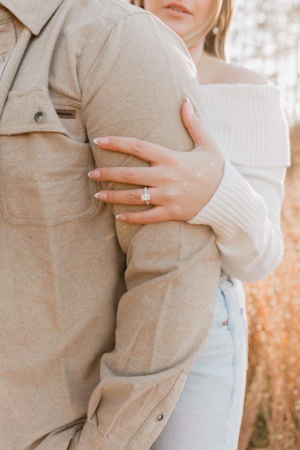 Close-up shots of someone wearing a cozy beige sweater holding a white coffee mug against an autumn backdrop.