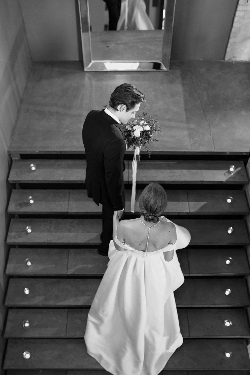 Artistic overhead shots of a couple dancing on illuminated wooden steps during their wedding celebration.