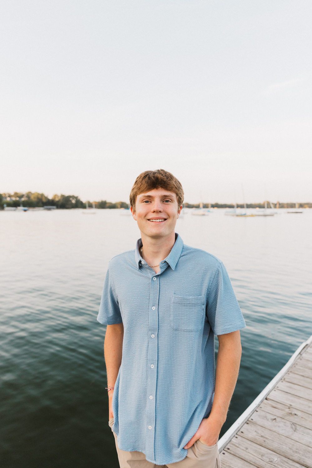 Series of casual waterfront photos with person in light blue button-down shirt on wooden dock.