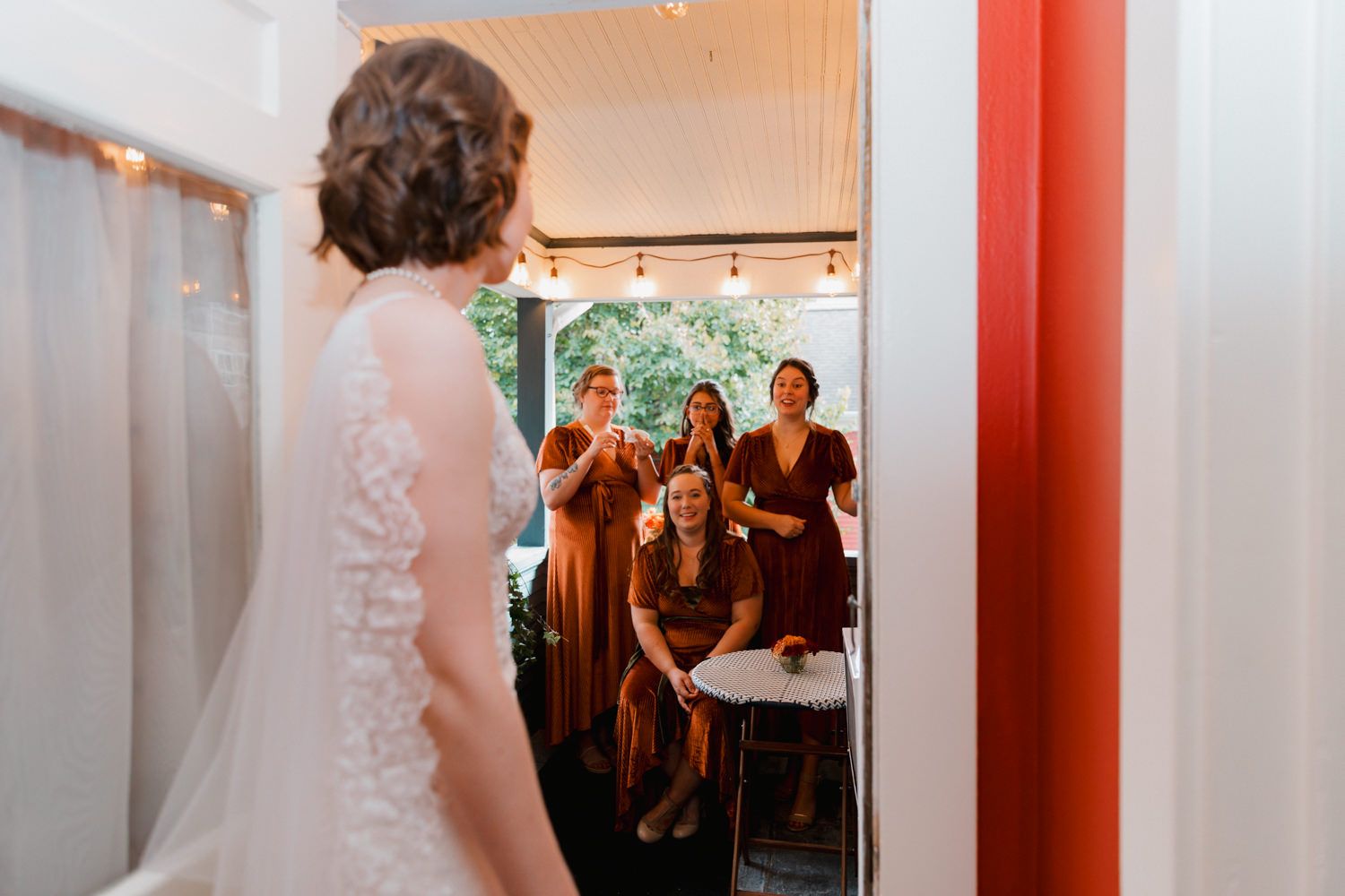 A sequence of candid wedding dress shopping photos with orange-tinted frames and warm lighting.