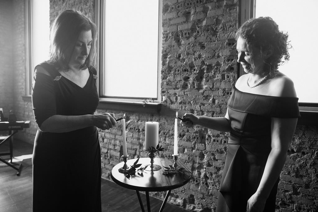 Artistic black and white photoshoot series capturing candid moments in a rustic indoor setting.