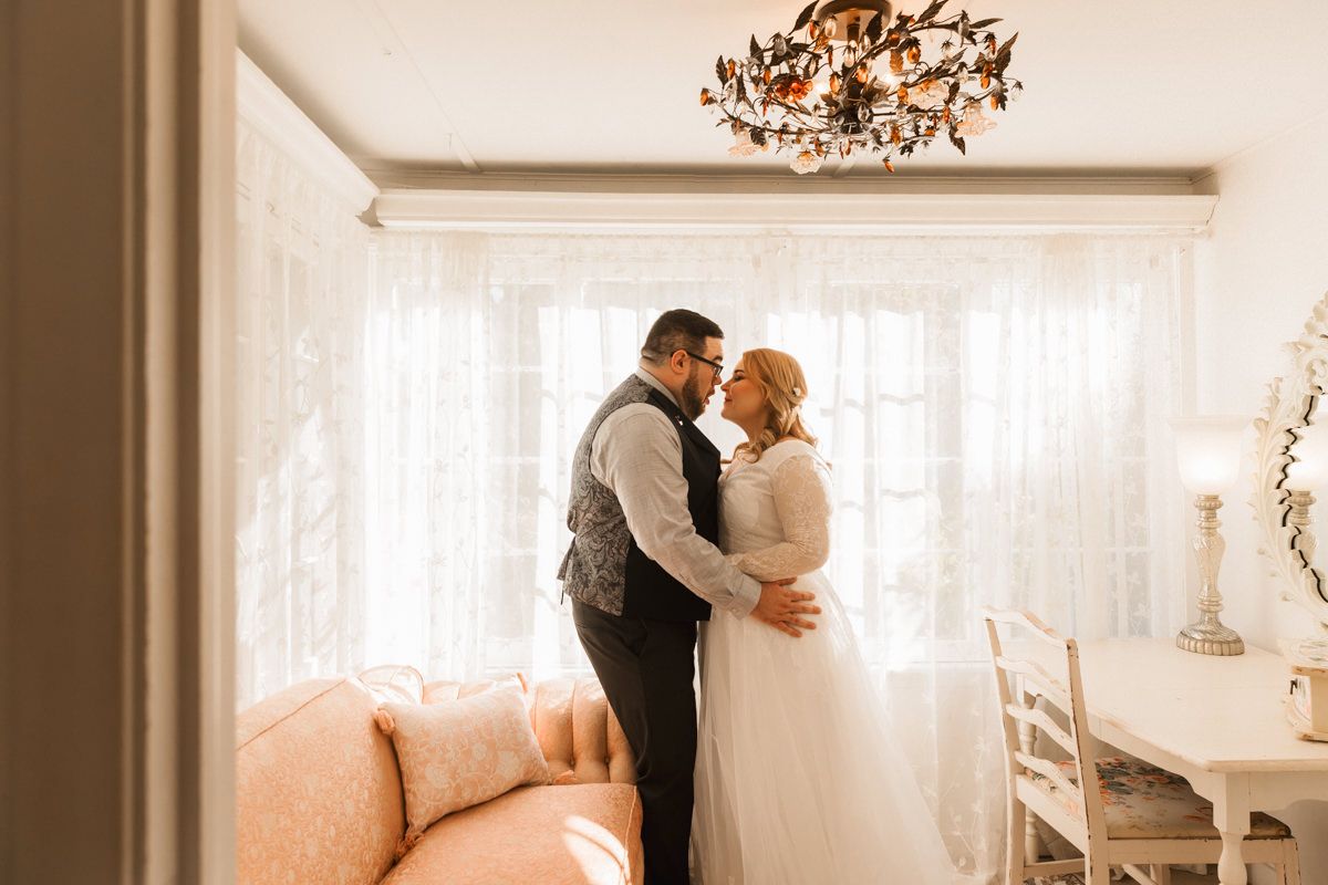 A romantic wedding photoshoot sequence showing intimate moments between newlyweds in a sunlit room.
