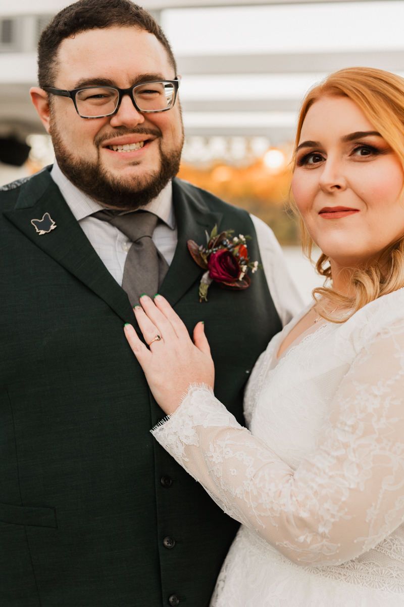 Romantic wedding portraits show newlyweds in intimate close-ups with bride in lace sleeves and groom in dark suit.