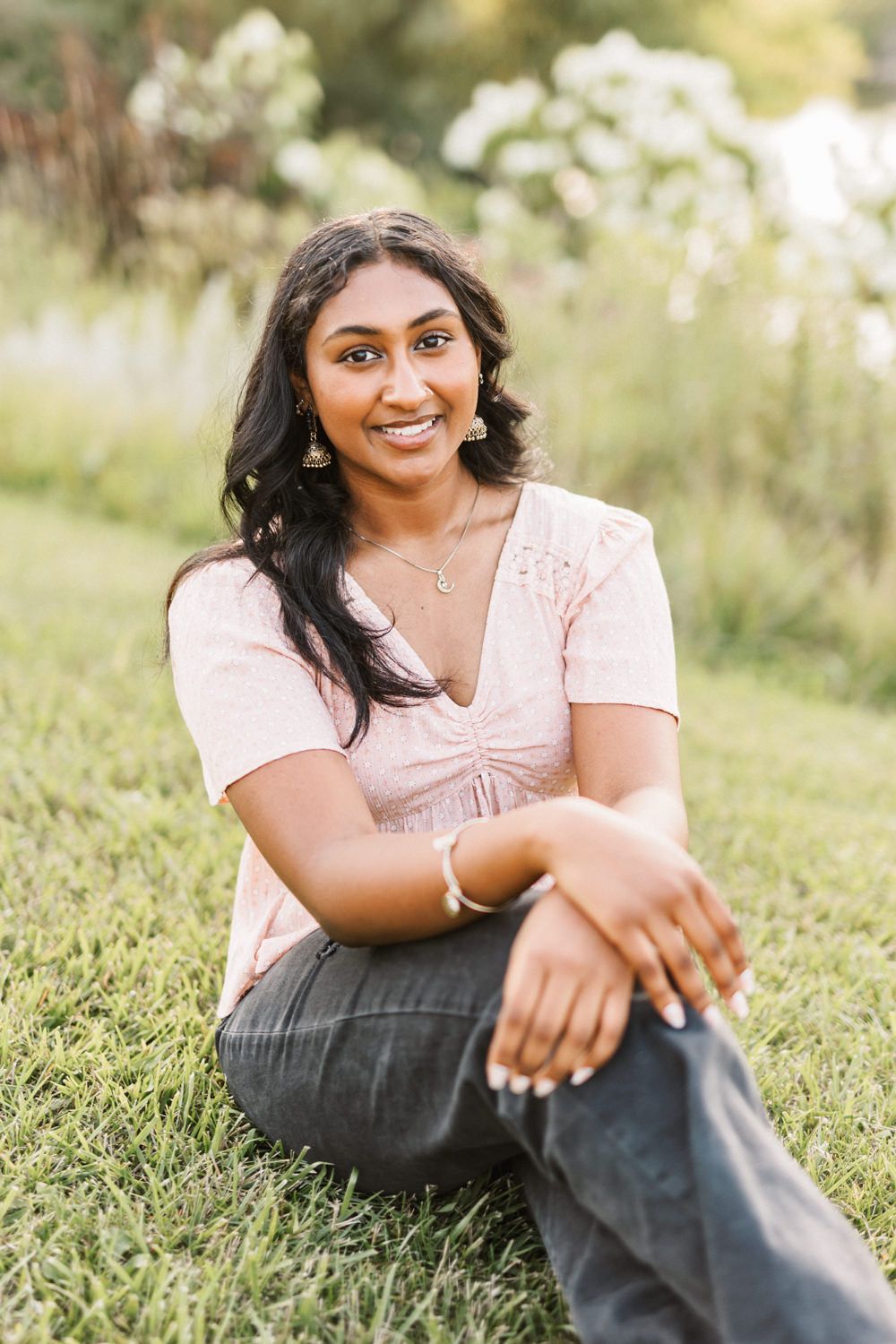Casual portrait session in grass with golden hour lighting.