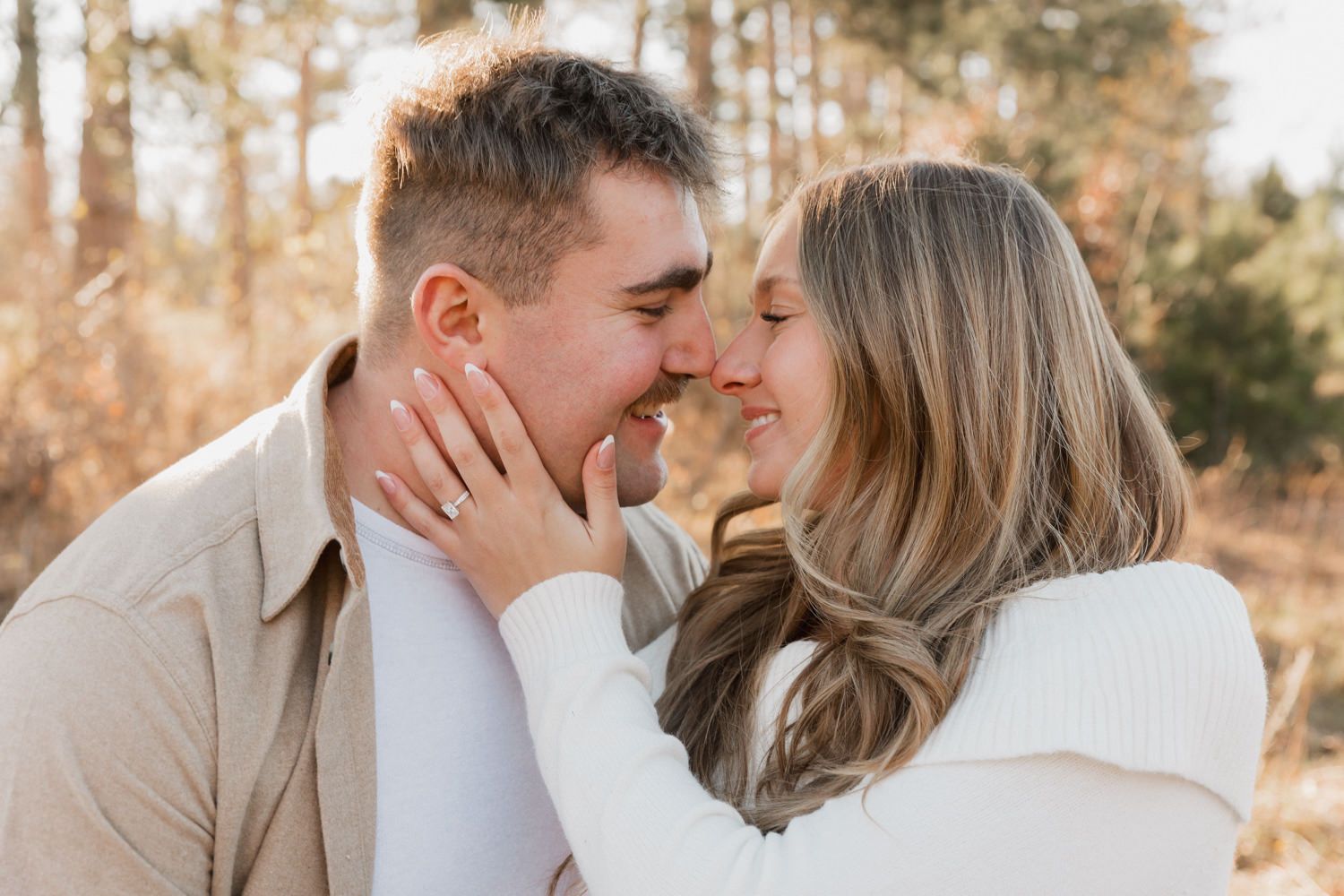 A series of tender close-up moments between a couple in warm autumn lighting.