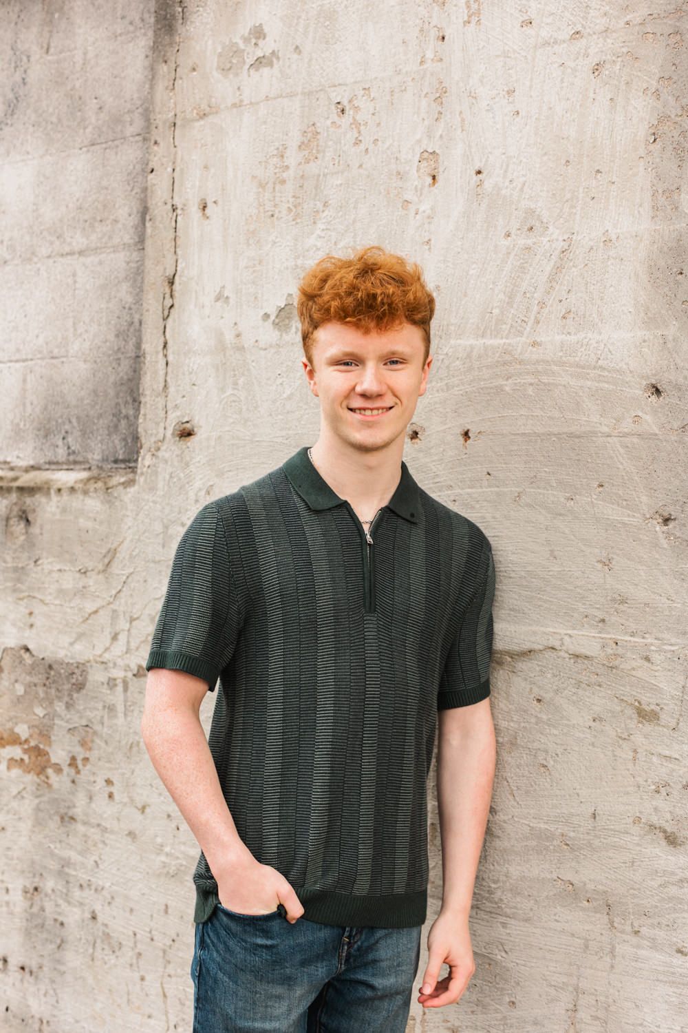 Casual portrait series against a light concrete wall showing relaxed poses.