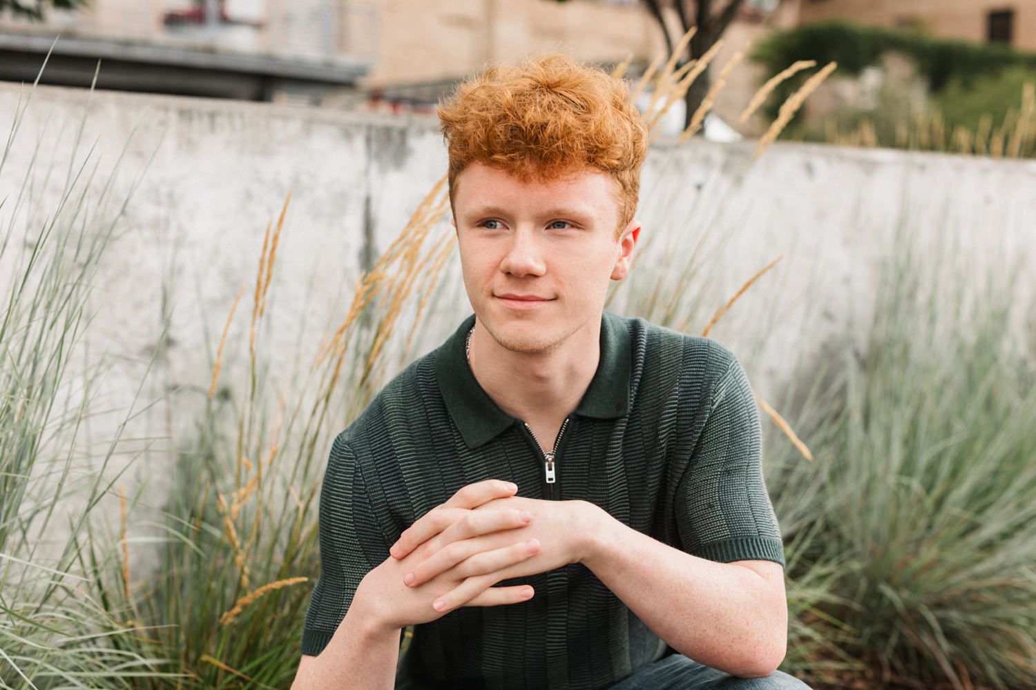 Outdoor portrait series with natural foliage and architectural elements in the background.