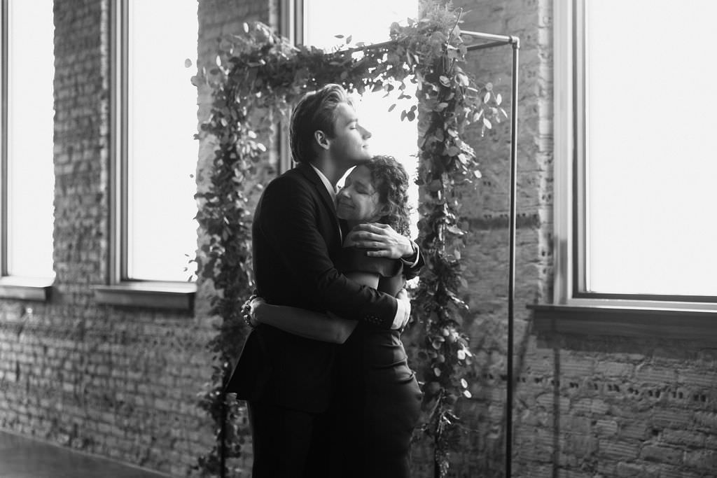 Elegant wedding venue with brick walls and natural light from large windows.