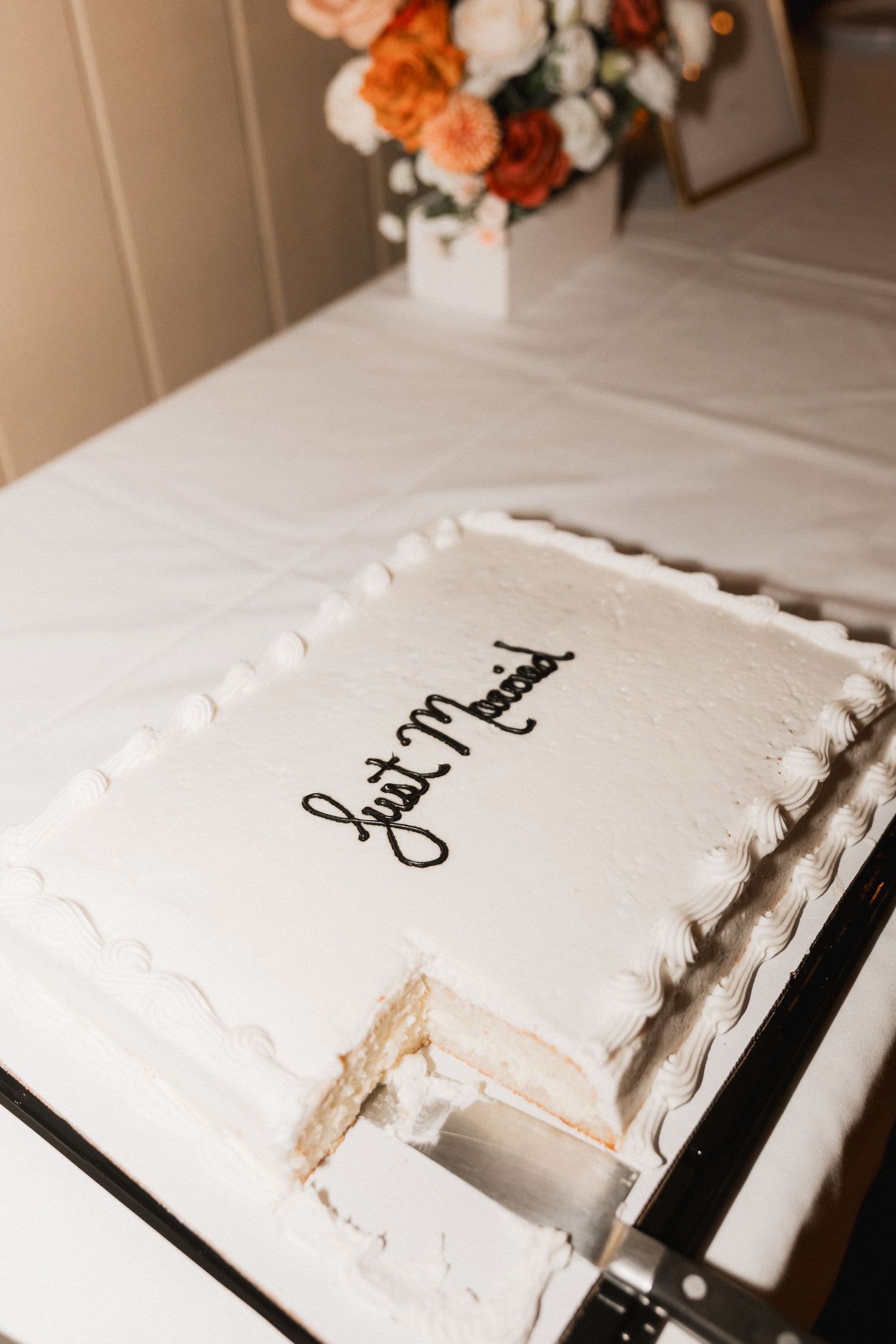 A series of white frosted cake slices with decorative text being progressively cut and eaten on a white plate.