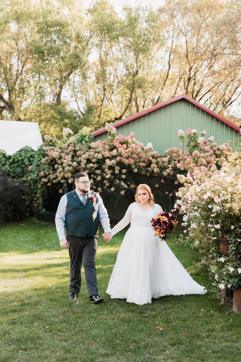 A romantic wedding photo sequence in a garden with blooming roses and a green barn in the background.