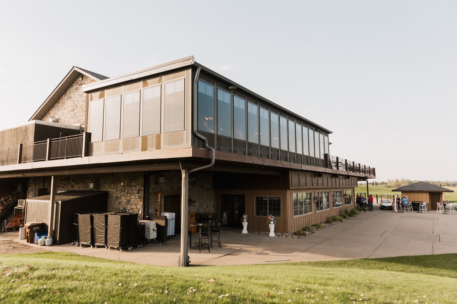 Modern wedding venue exterior featuring contemporary architecture and large glass windows.
