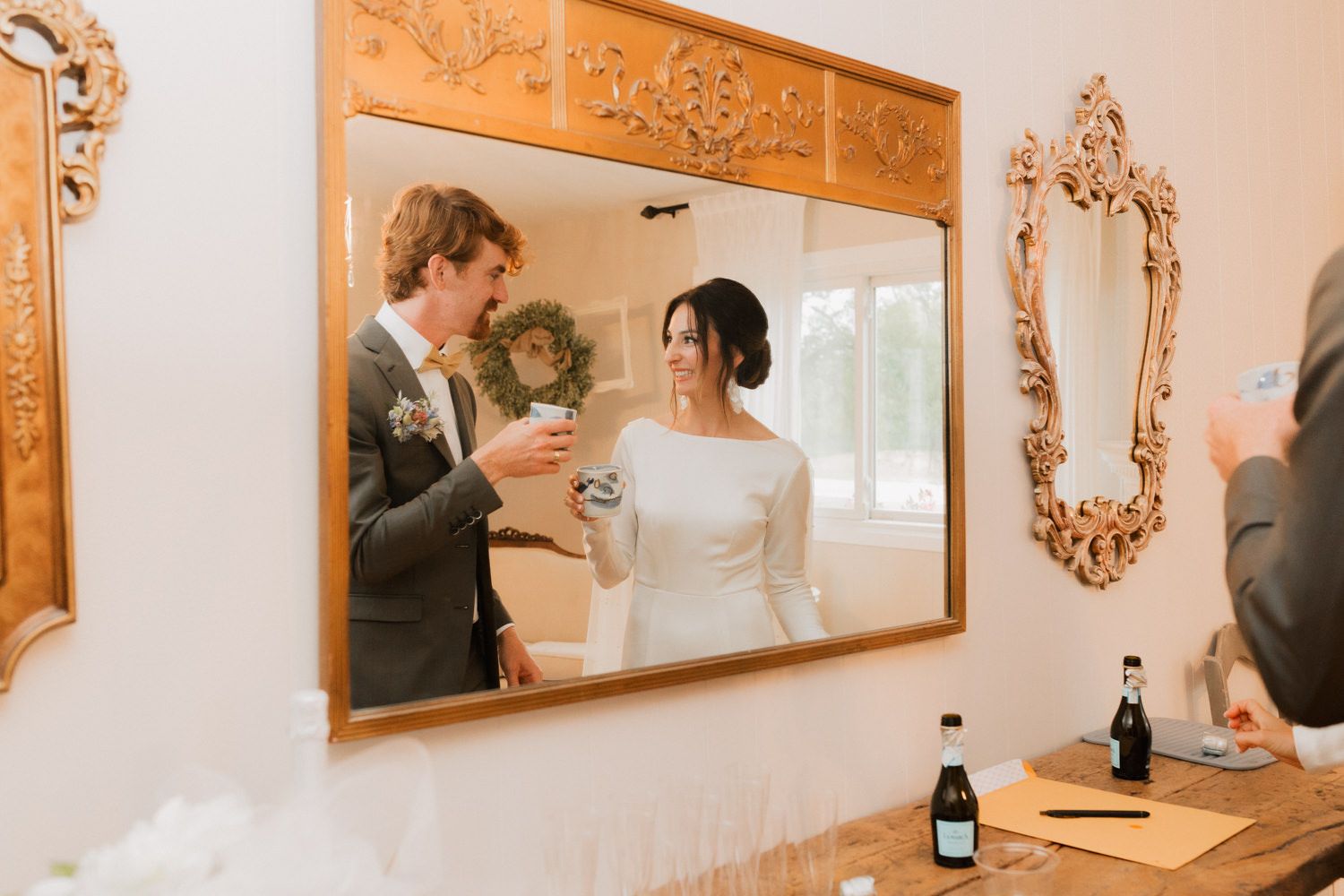 Elegant room with ornate gold mirrors and warm lighting creating a romantic atmosphere.