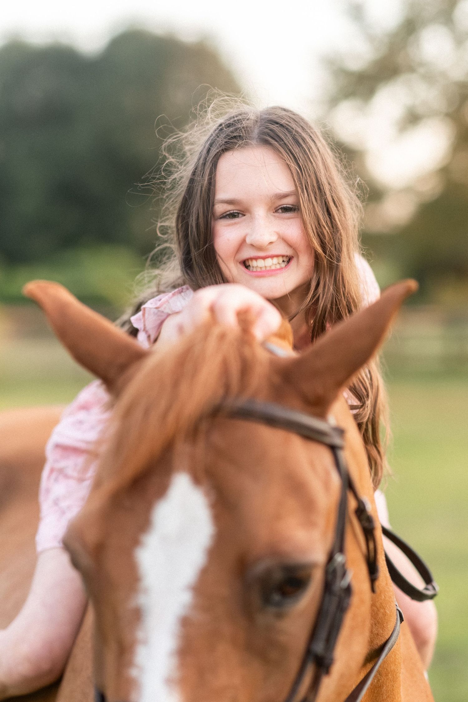 Young rider hugging her pony during a barn session in Ocala, Florida.
