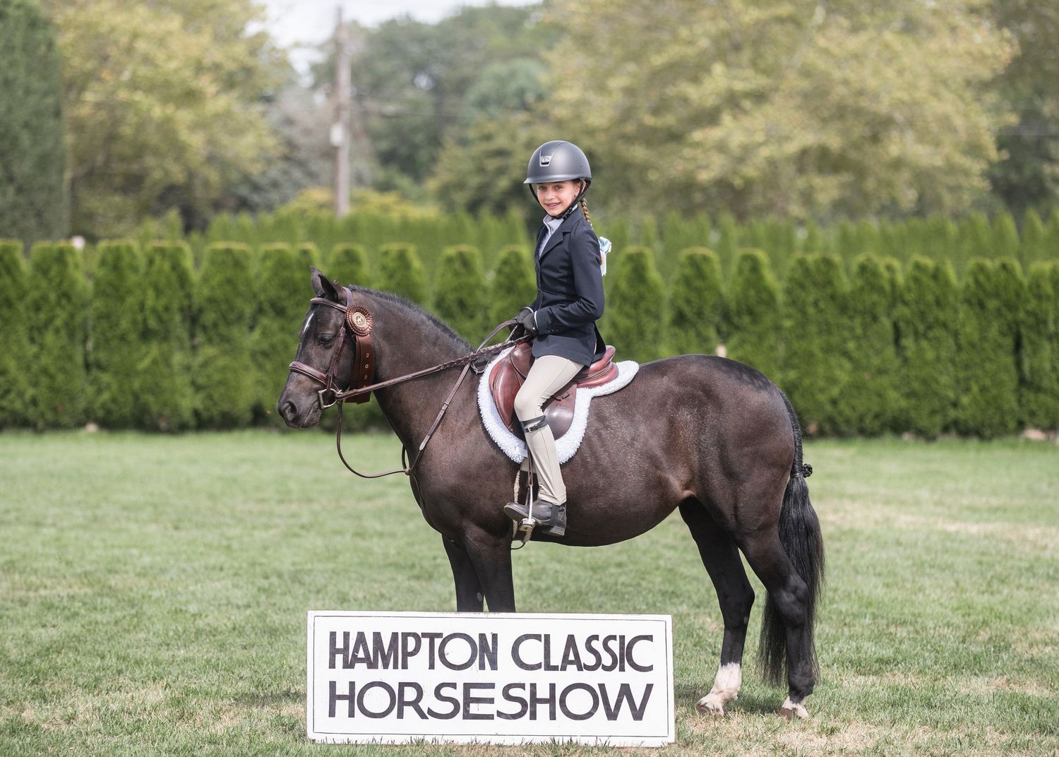 Hunter rider competing at The Hampton Classic Horse Show in Bridgehampton, NY