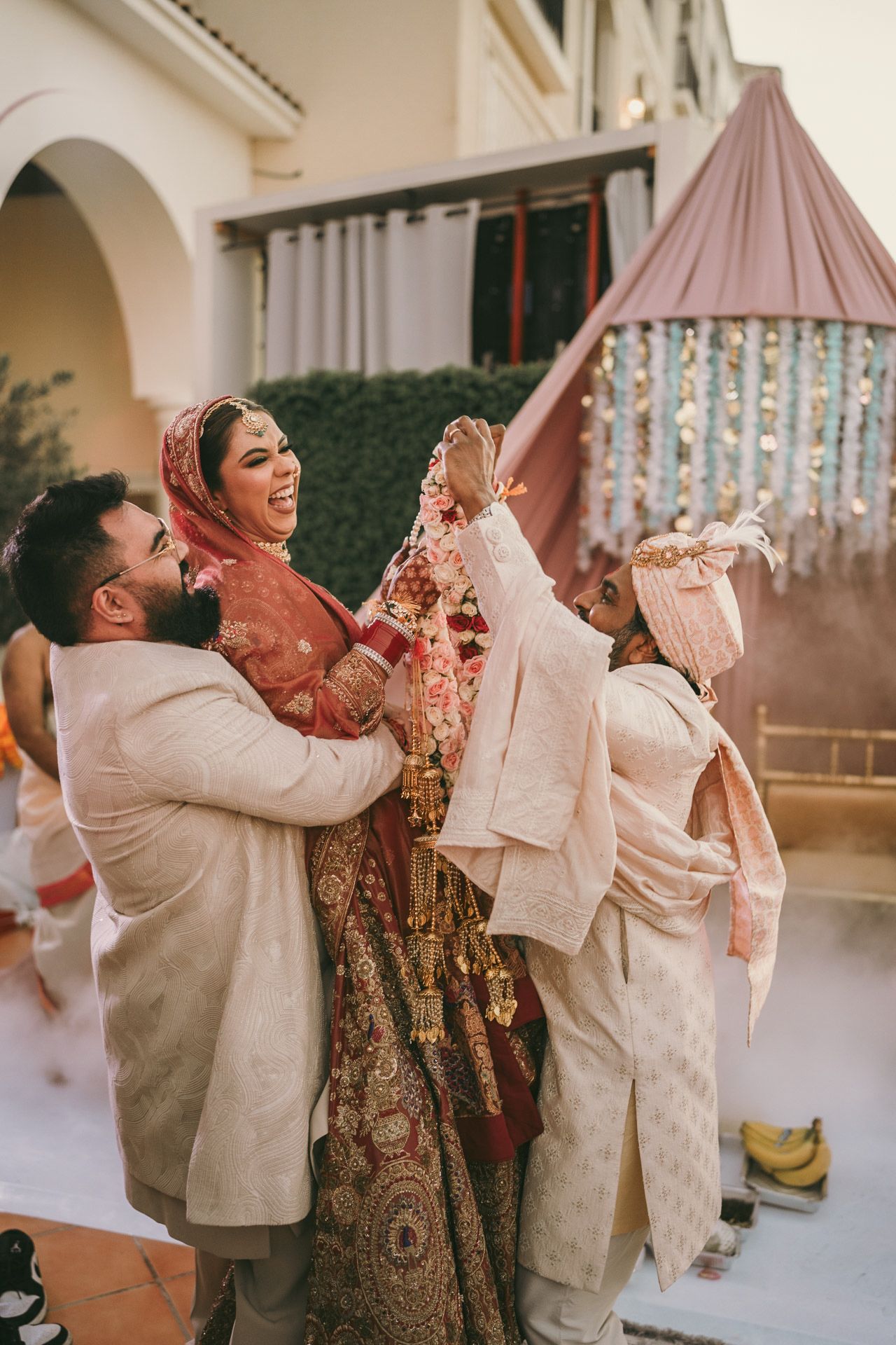 Heartfelt moment captured: bride and her brothe holding hands before the pooja, reflecting the deep love and tradition of Asian weddings