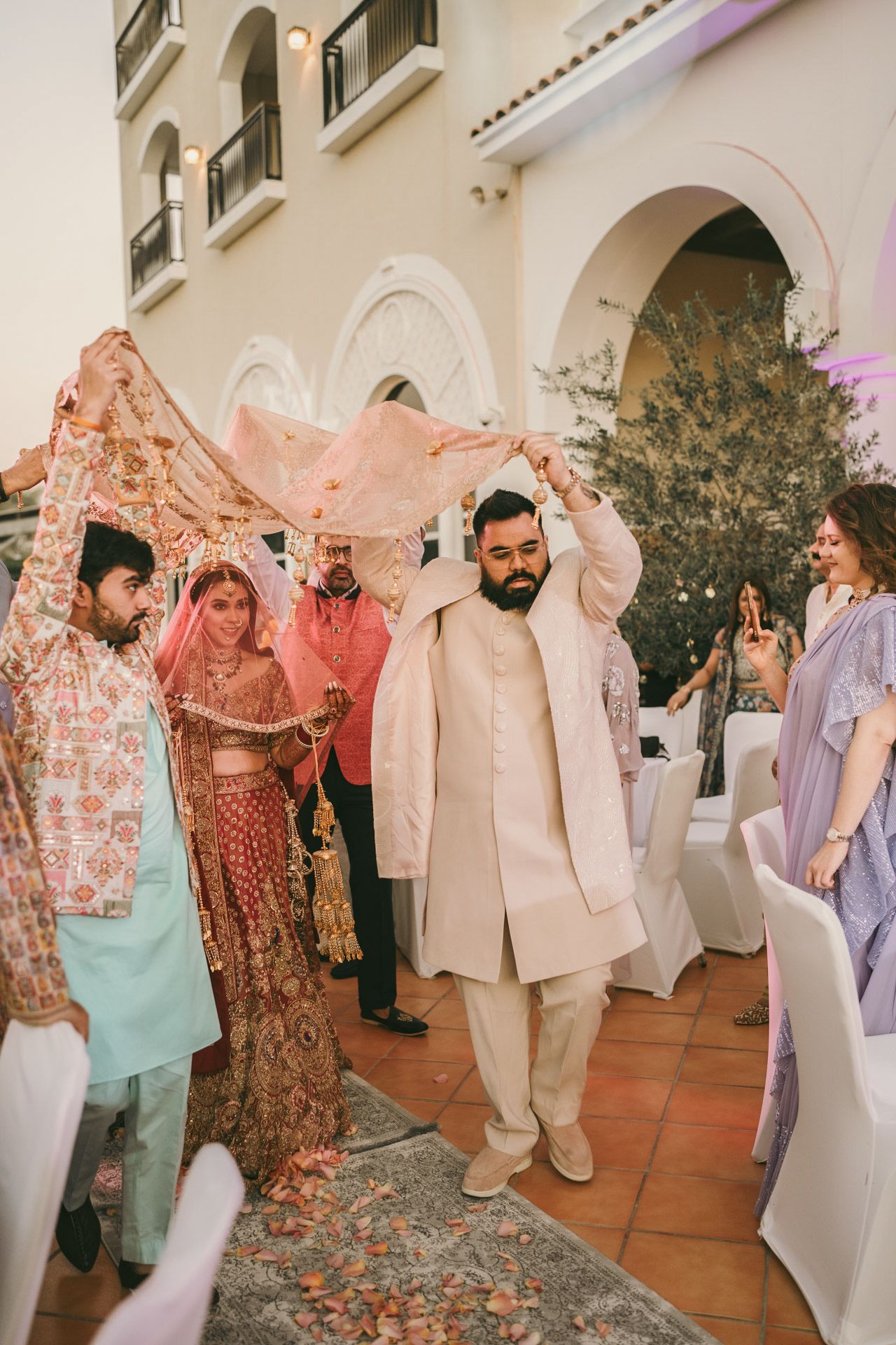 Heartfelt moment captured: bride and her sister holding hands before the nikkah, reflecting the deep love and tradition of South Asian weddi