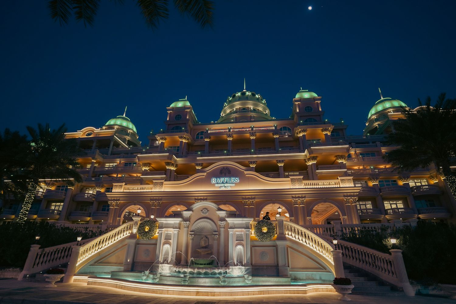 peach and blush floral mandap under open sky designed to elevate the ambiance of a high-end multicultural wedding celebration.