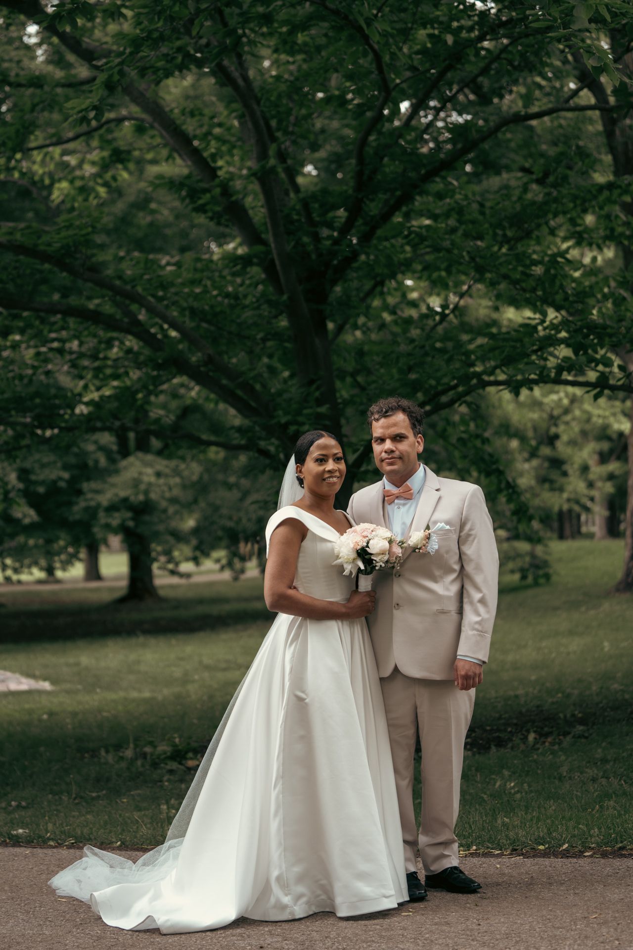 Bride’s train elegantly trailing behind as the couple walks down the aisle post-ceremony.