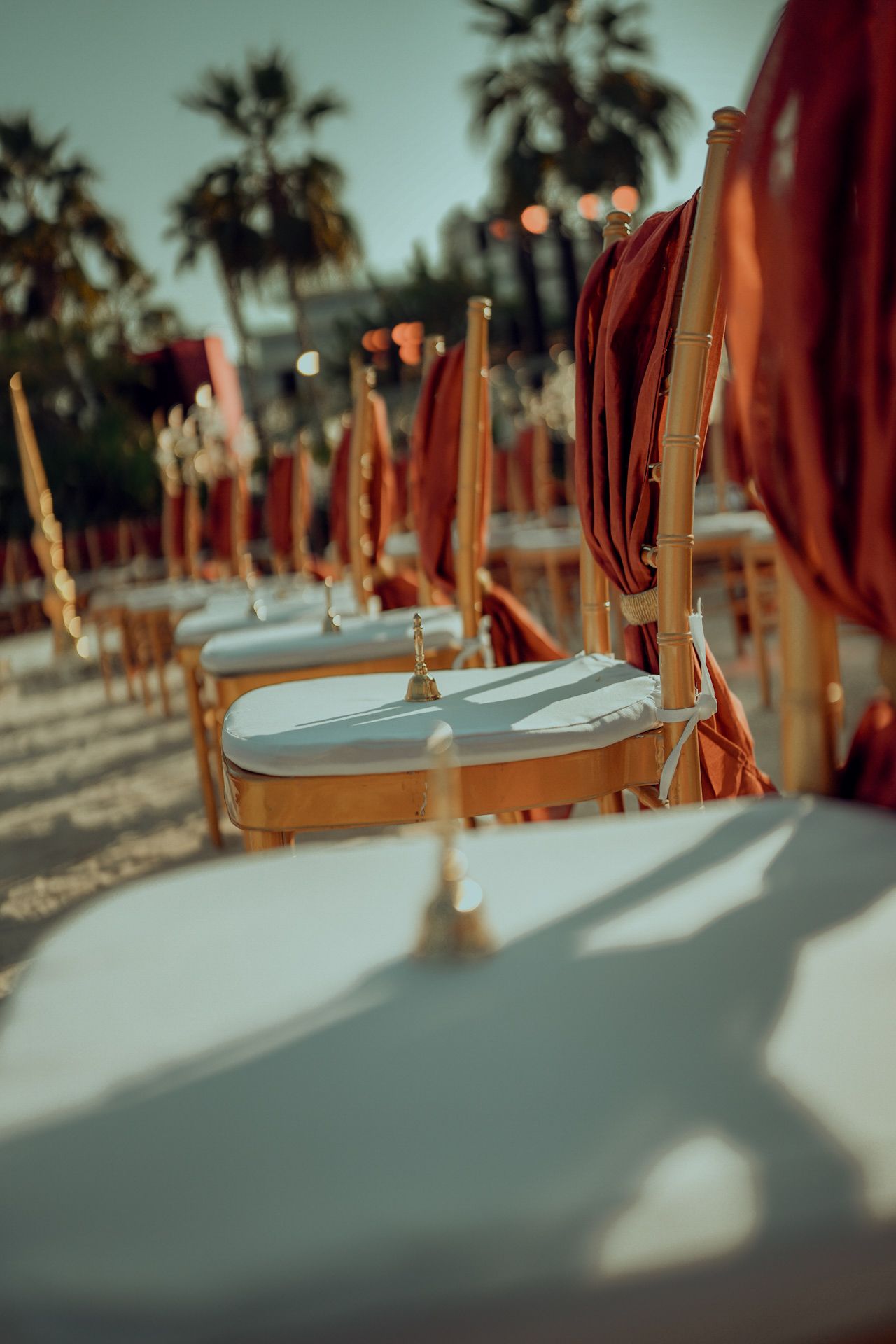 elegant mirror table with floating candles designed to elevate the ambiance of a high-end multicultural wedding celebration.