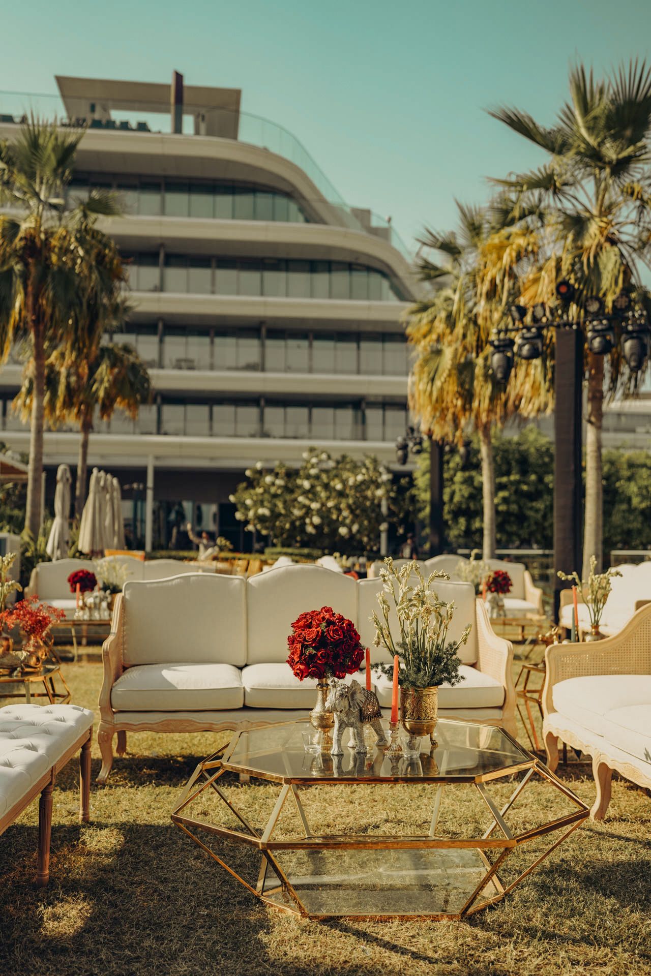 traditional red decor with lotus motifs designed to elevate the ambiance of a high-end multicultural wedding celebration at W Hotel.