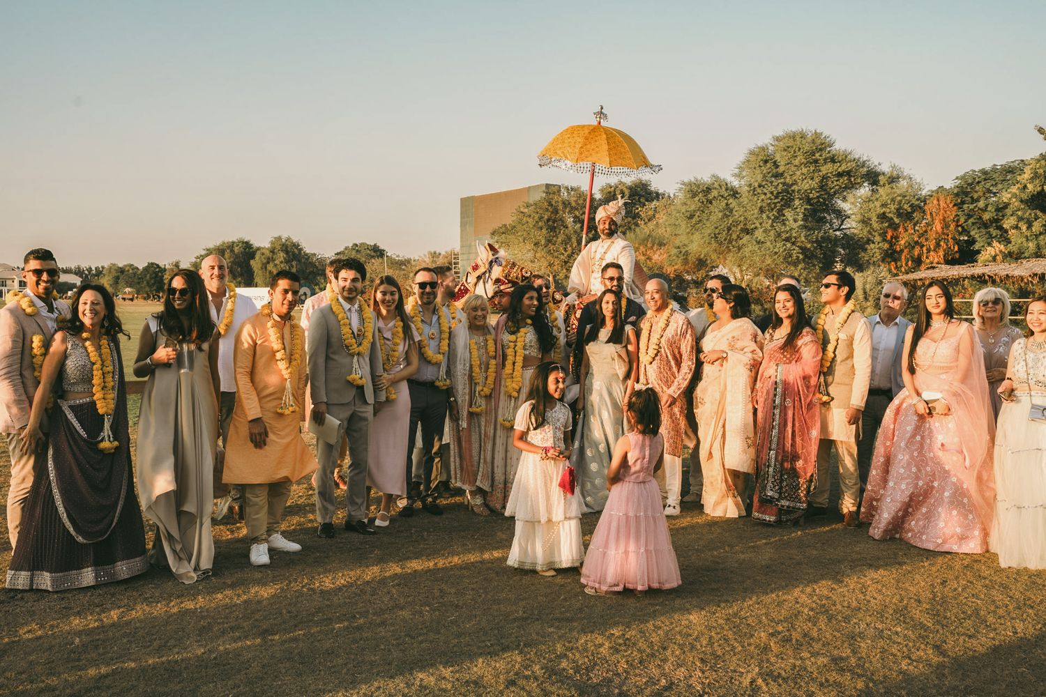 Heartfelt moment captured: bride’s niece giving her a flower, reflecting the deep love and tradition of South Asian weddings.