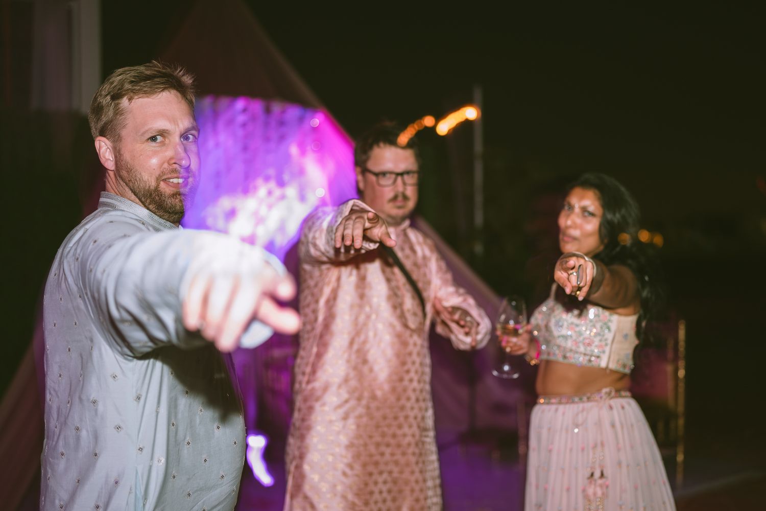 Heartfelt moment captured: siblings laughing in haldi turmeric ceremony, reflecting the deep love and tradition of South Asian weddings.