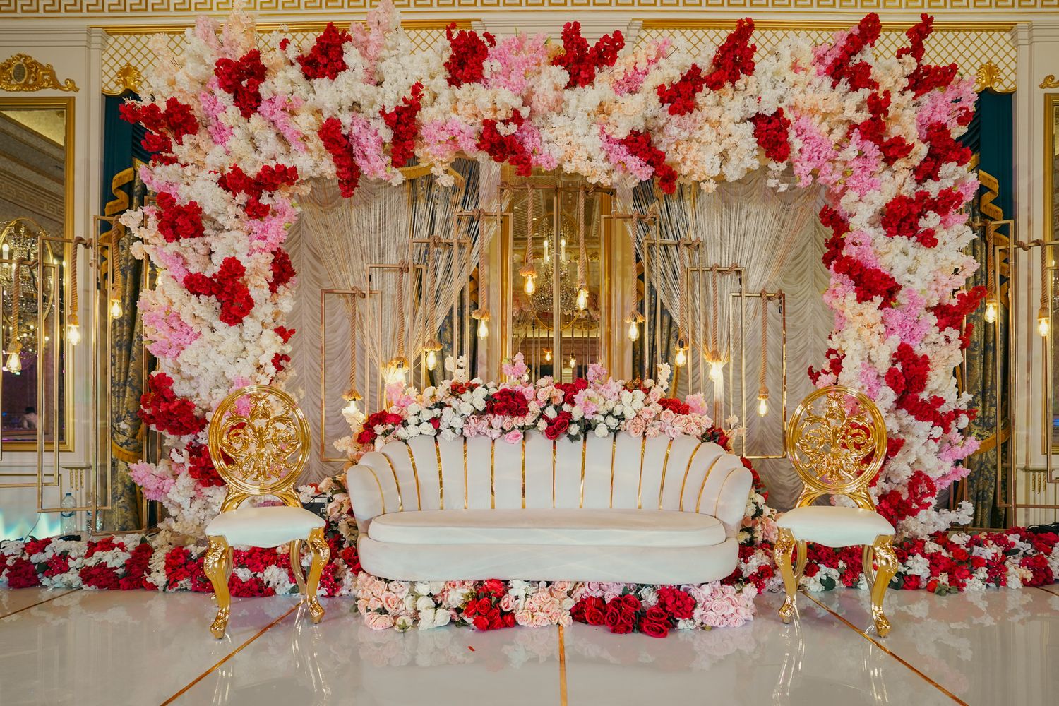 whimsical garden-style reception setup designed to elevate the ambiance of a high-end multicultural wedding celebration.