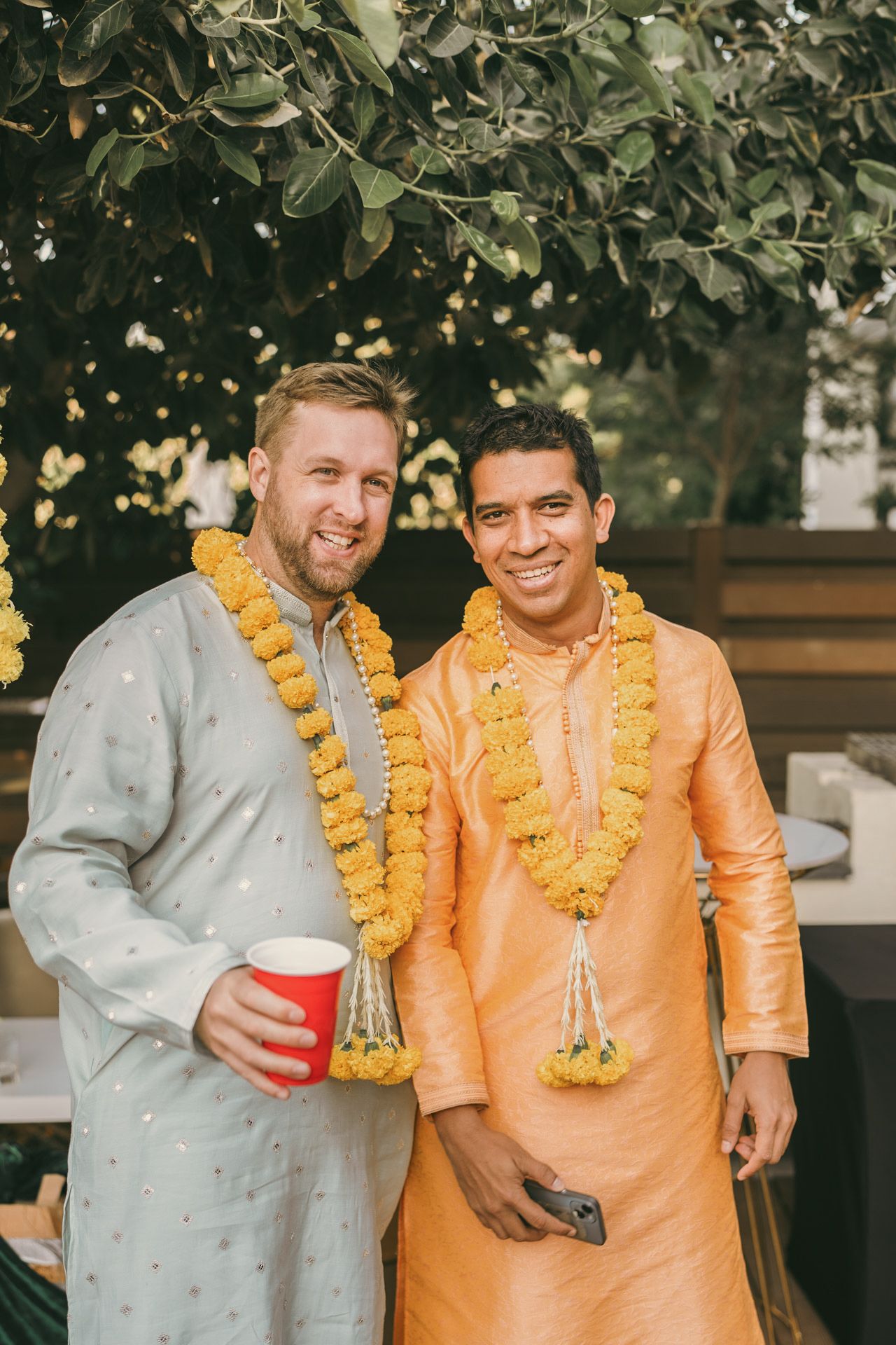 Heartfelt moment captured: cousins hugging the groom after the ring ceremony, reflecting the deep love and tradition of South Asian weddings