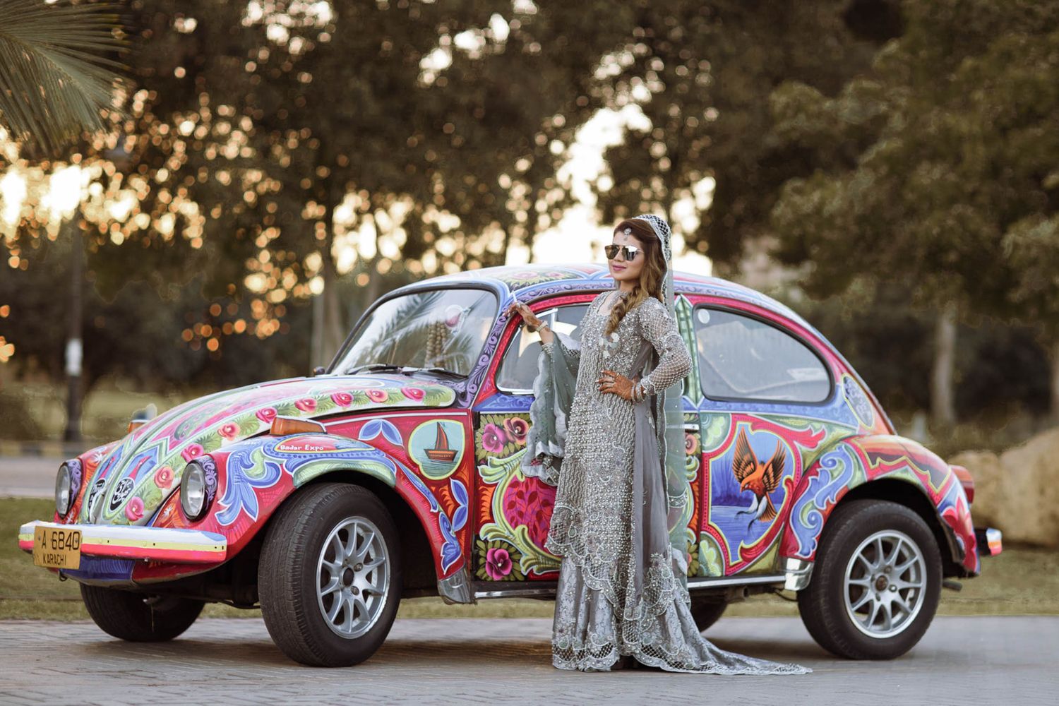 Traditional reception entry in Lahore with the groom on a foxy truckart car and fireworks lighting the path later in the event coverage