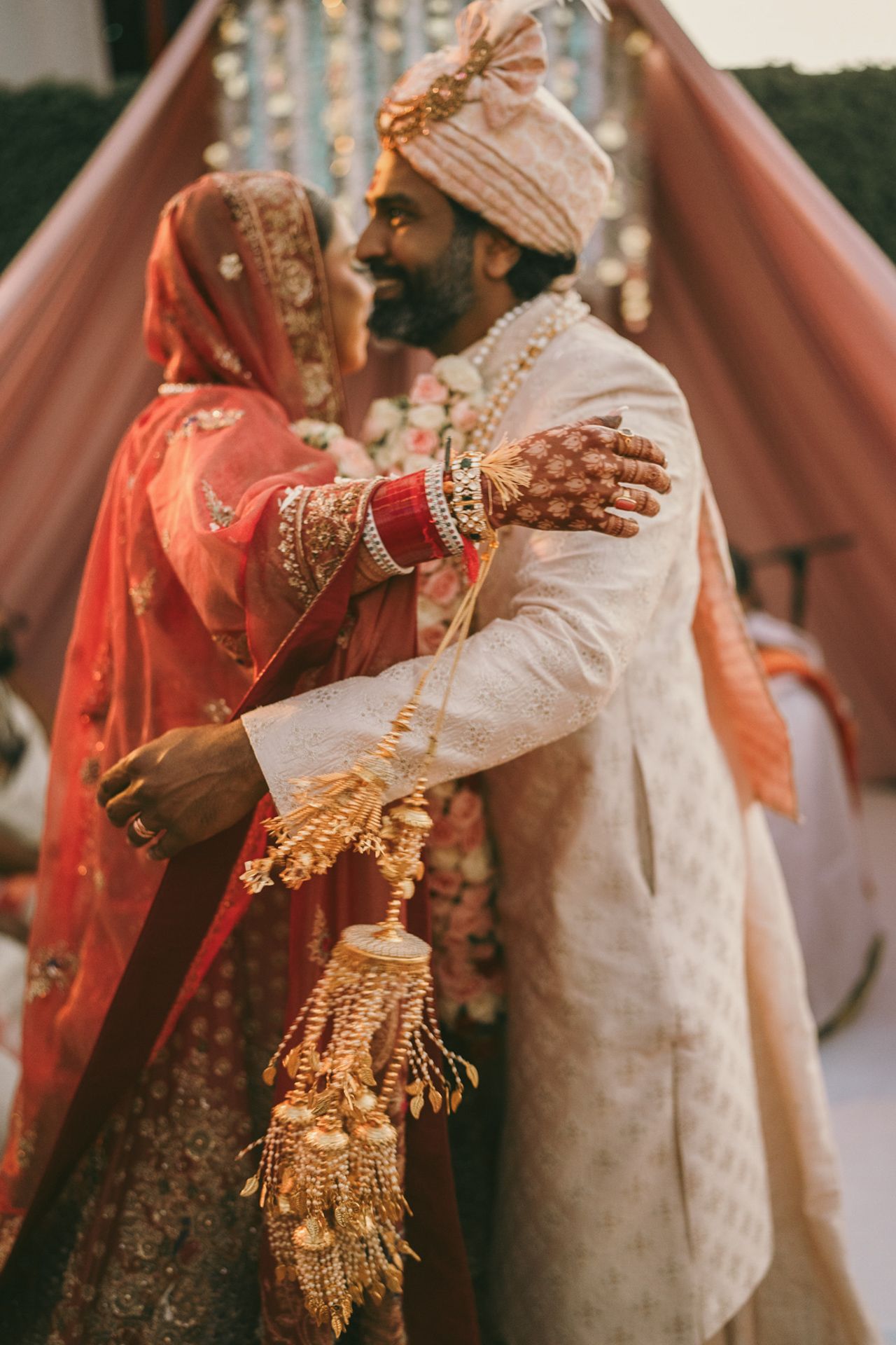 Heartfelt moment captured: cousins hugging the groom after the ring ceremony, reflecting the deep love and tradition of South Asian weddings