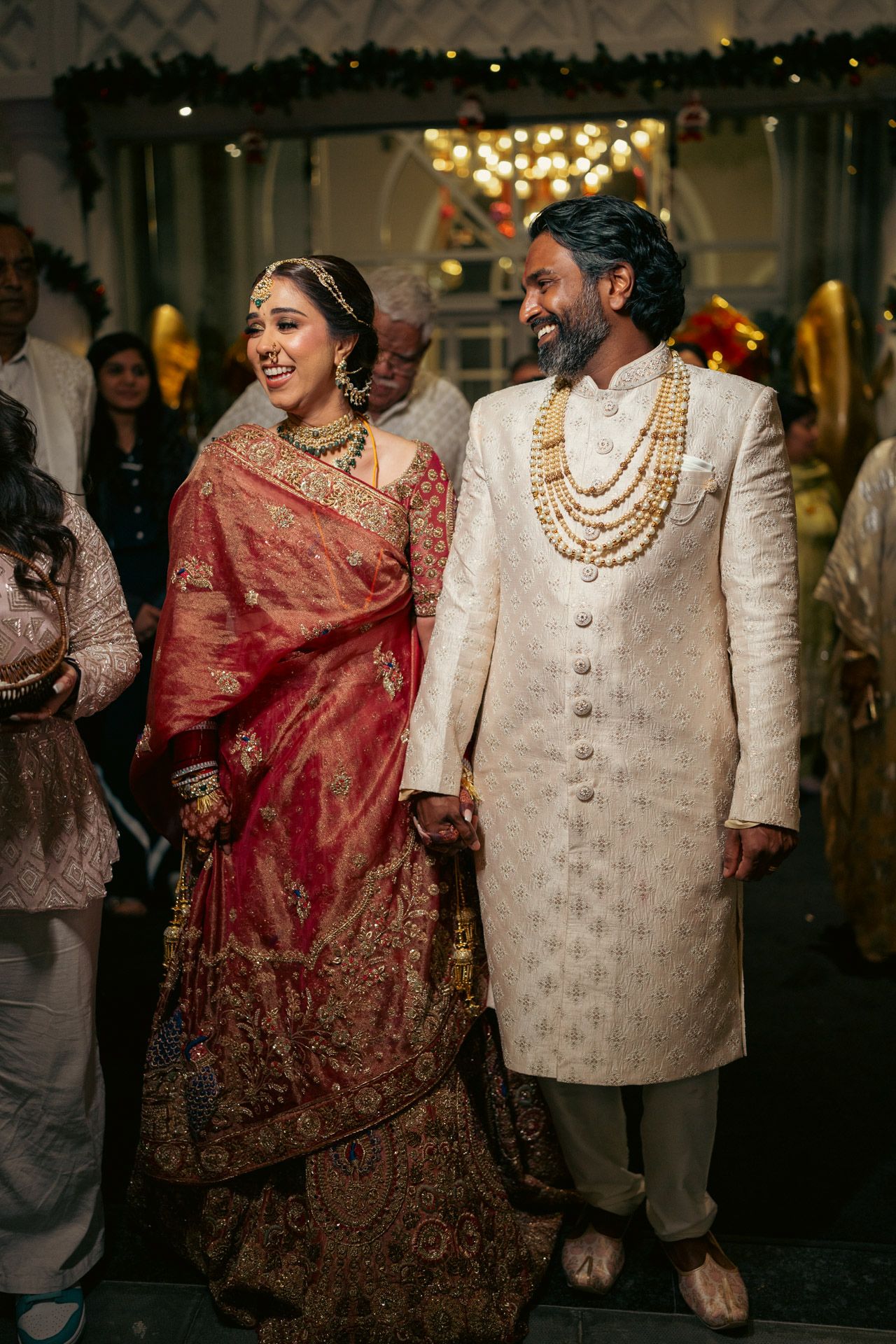 Heartfelt moment captured: siblings laughing in haldi turmeric ceremony, reflecting the deep love and tradition of South Asian weddings.