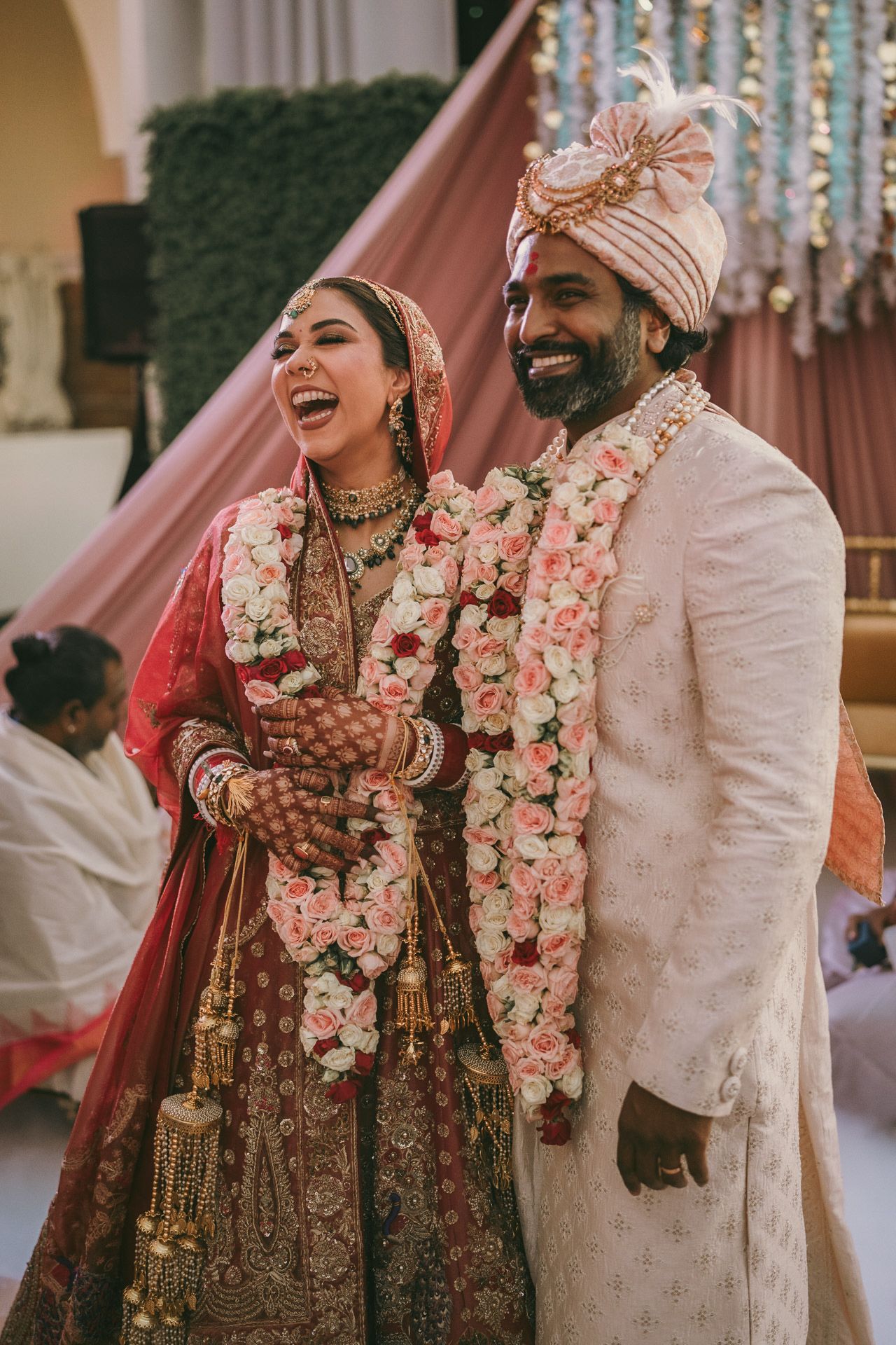 Heartfelt moment captured: cousins hugging the groom after the ring ceremony, reflecting the deep love and tradition of South Asian weddings